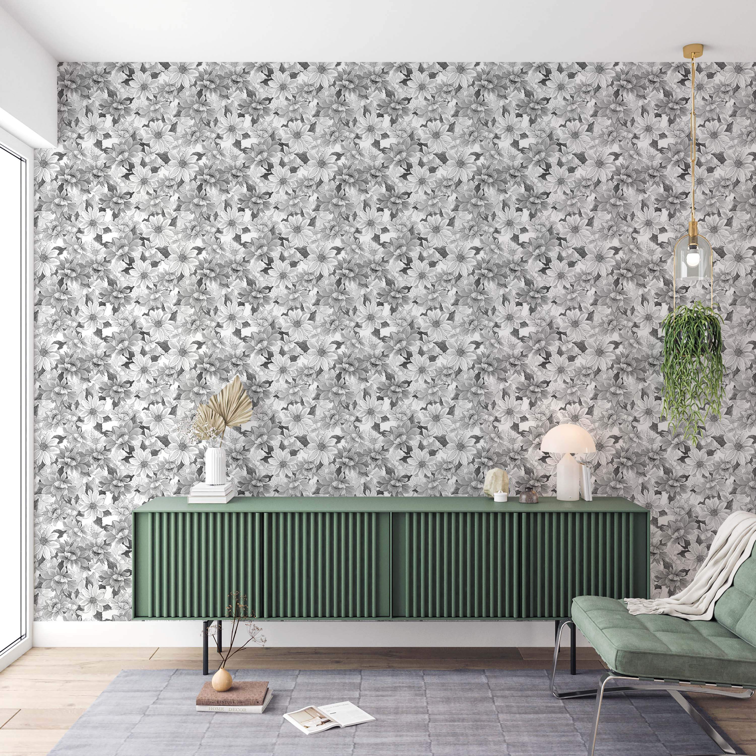 Wallpaper showing a dense pattern of large grayscale flowers and leaves in black, white, and gray tones.