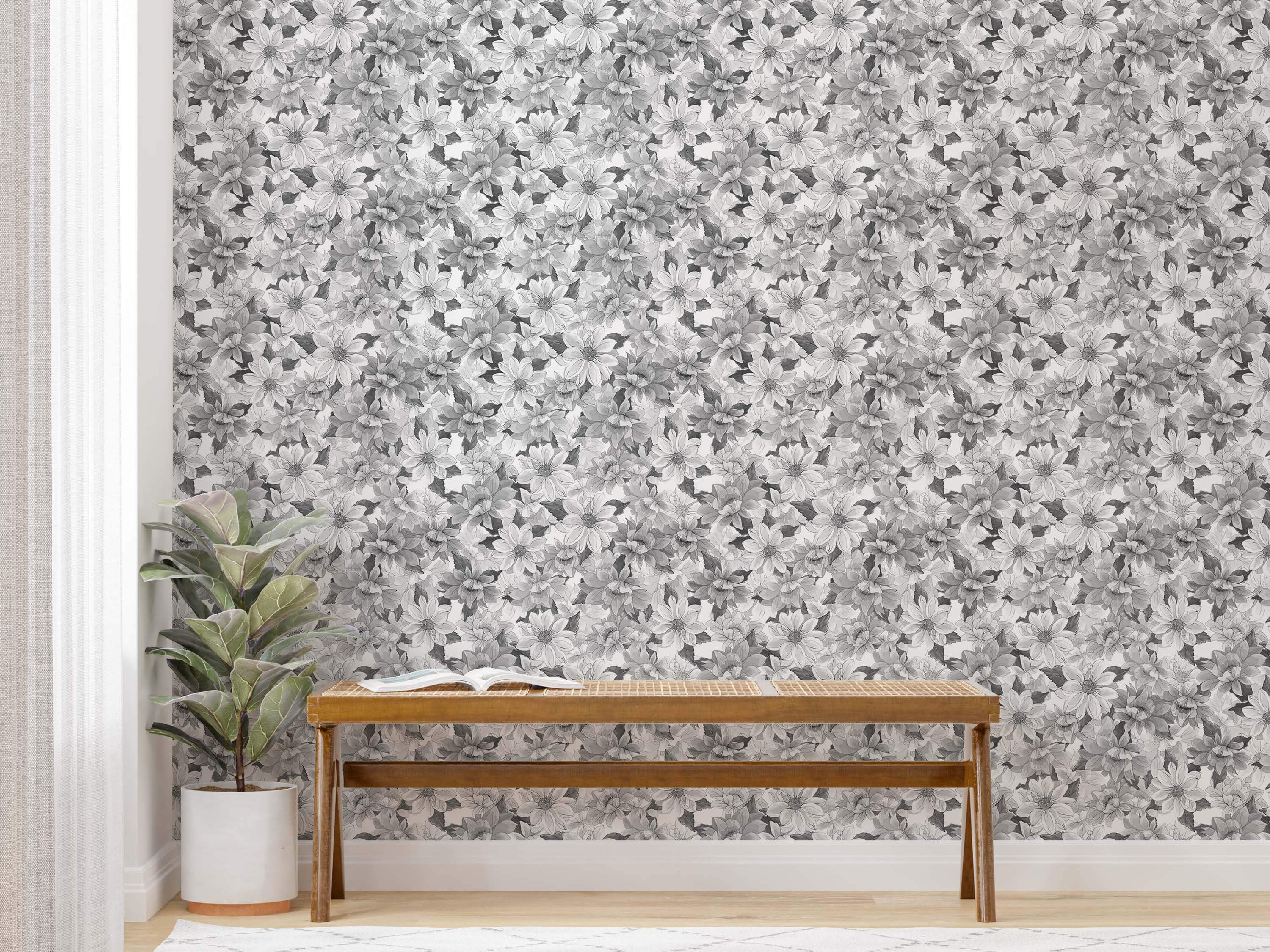 Wallpaper featuring a dense pattern of overlapping flowers rendered in shades of gray, black, and white.