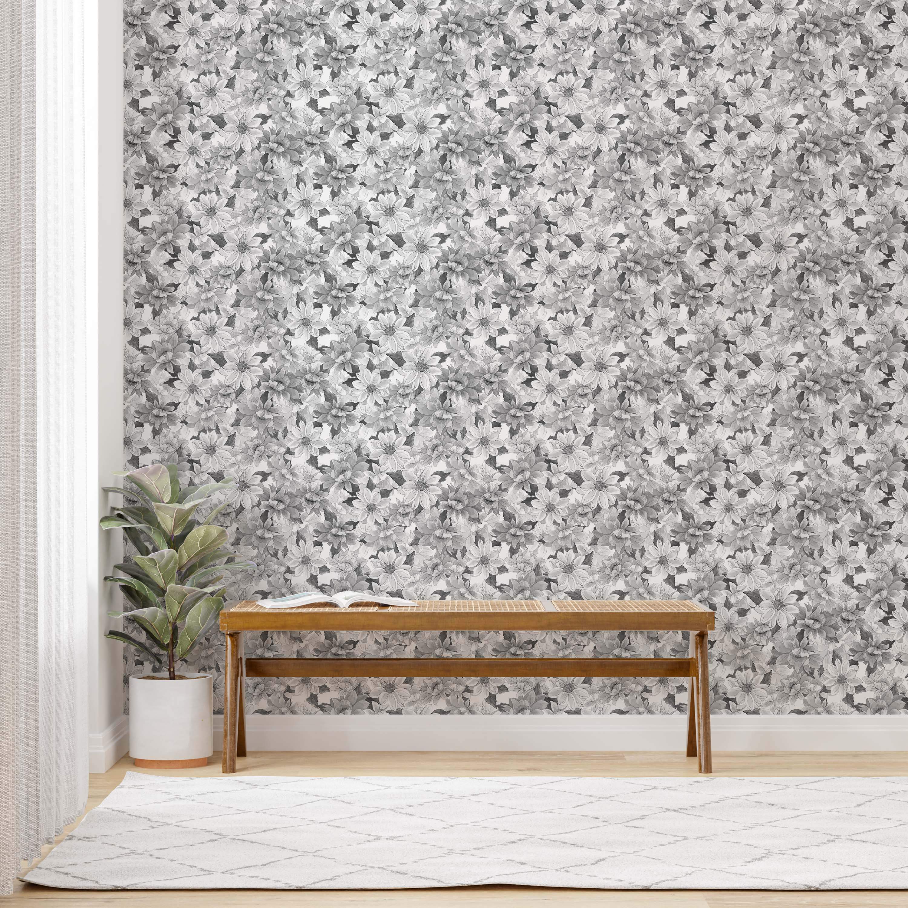 Wallpaper featuring a dense pattern of overlapping flowers rendered in shades of gray, black, and white.