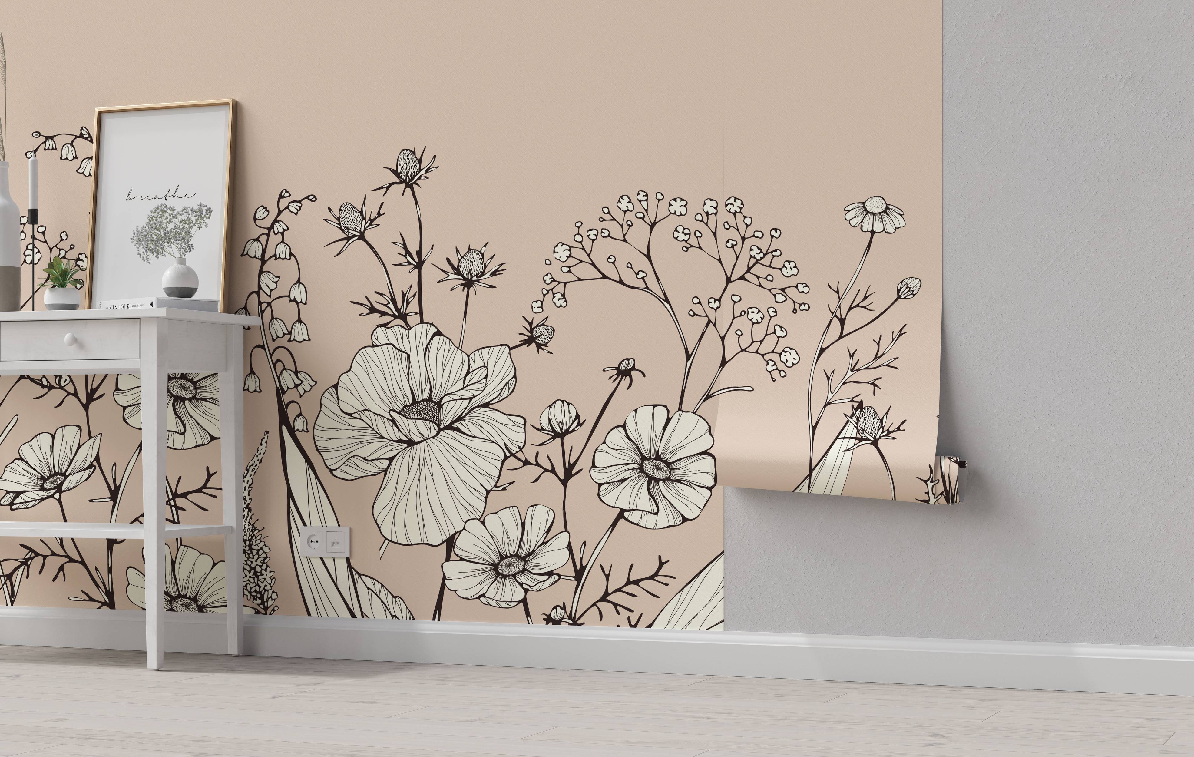Floral line art wallpaper with black outlined flowers, cream petal fills, on a pale beige background.