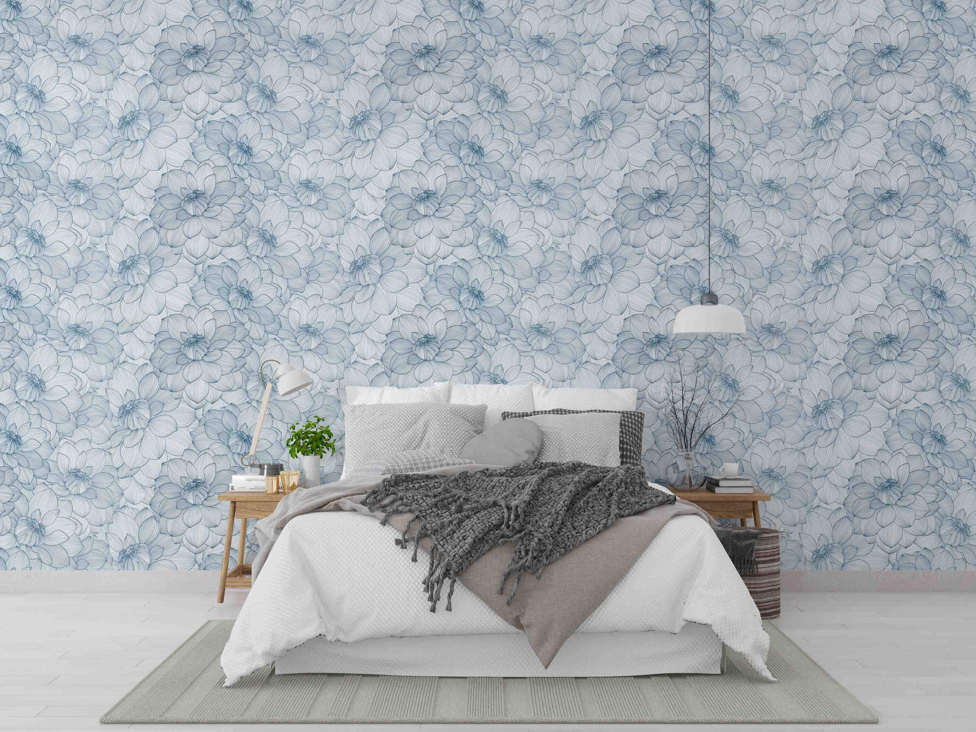 Wallpaper features a repeating pattern of large, blue line-drawn dahlia flowers on a light blue background.