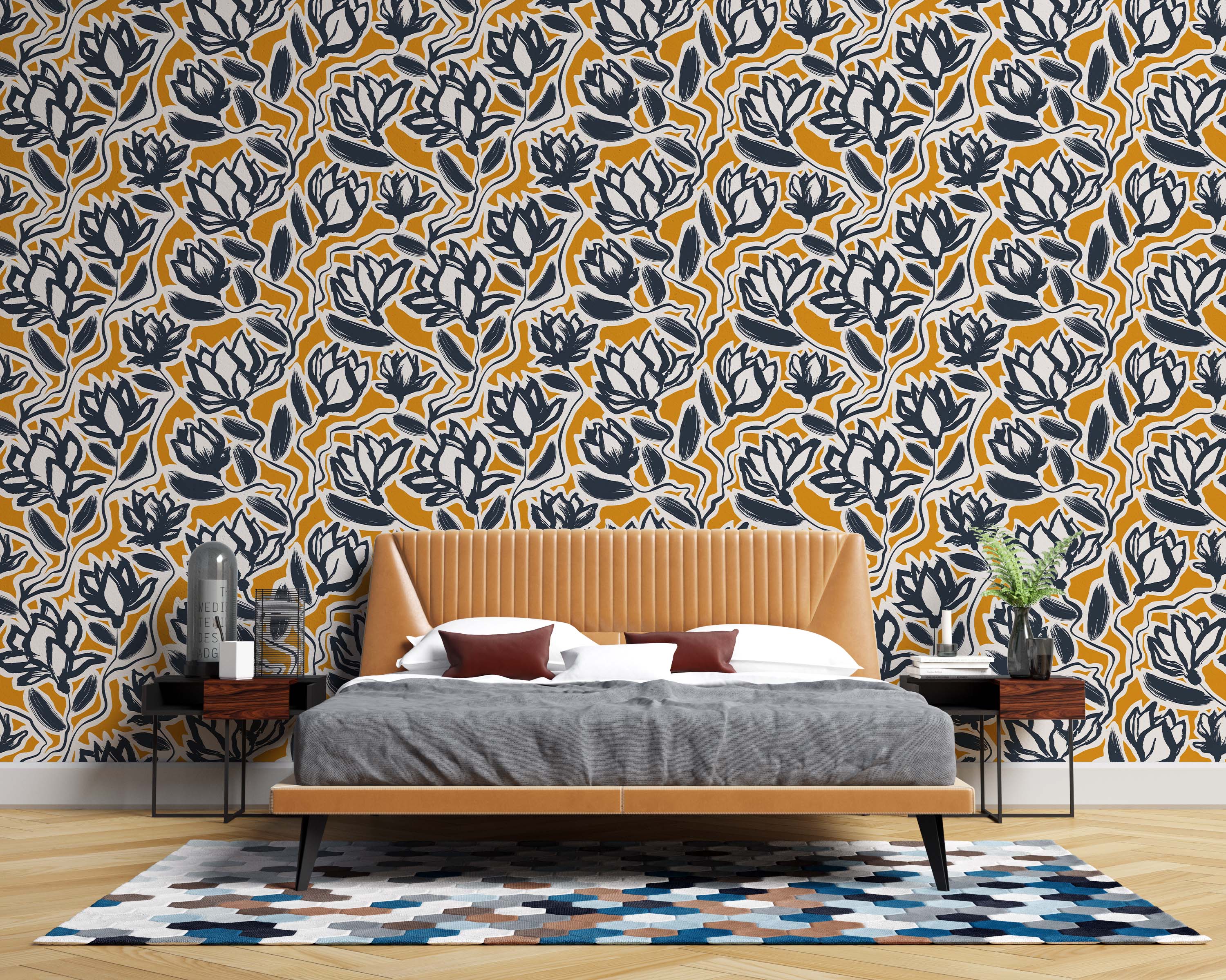 A modern floral wallpaper with a bold, painterly pattern of dark navy and off-white flowers on a rich mustard yellow field.