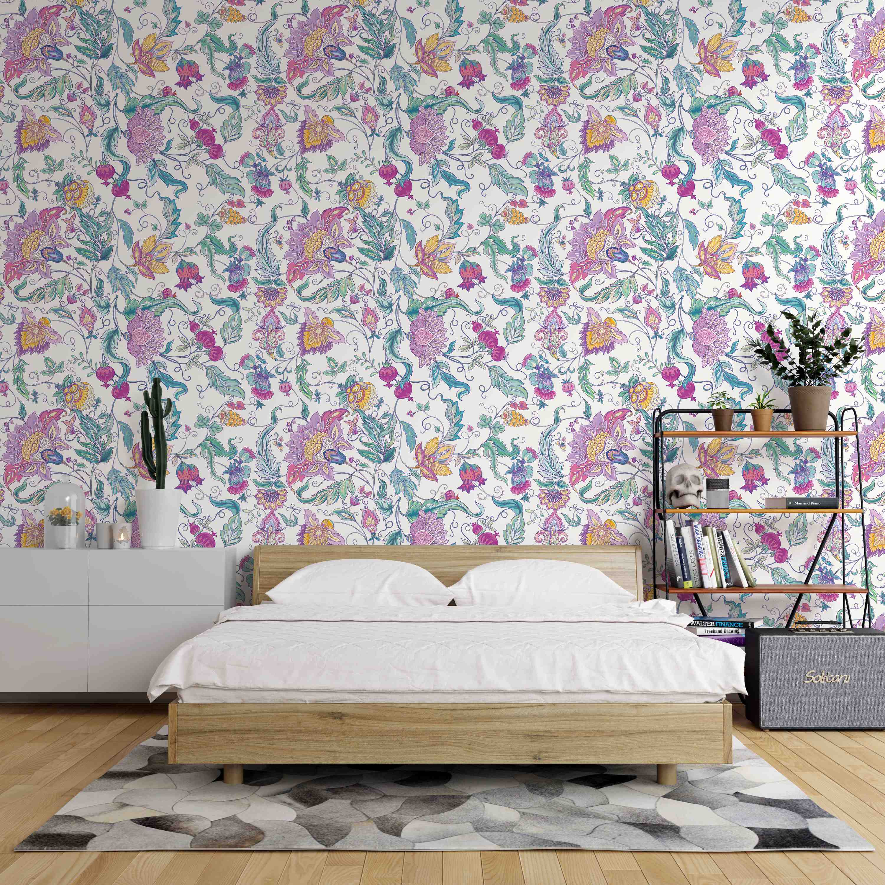 Stylized floral paisley wallpaper with pink, purple, yellow, and teal flowers and leaves entwined on a white background.