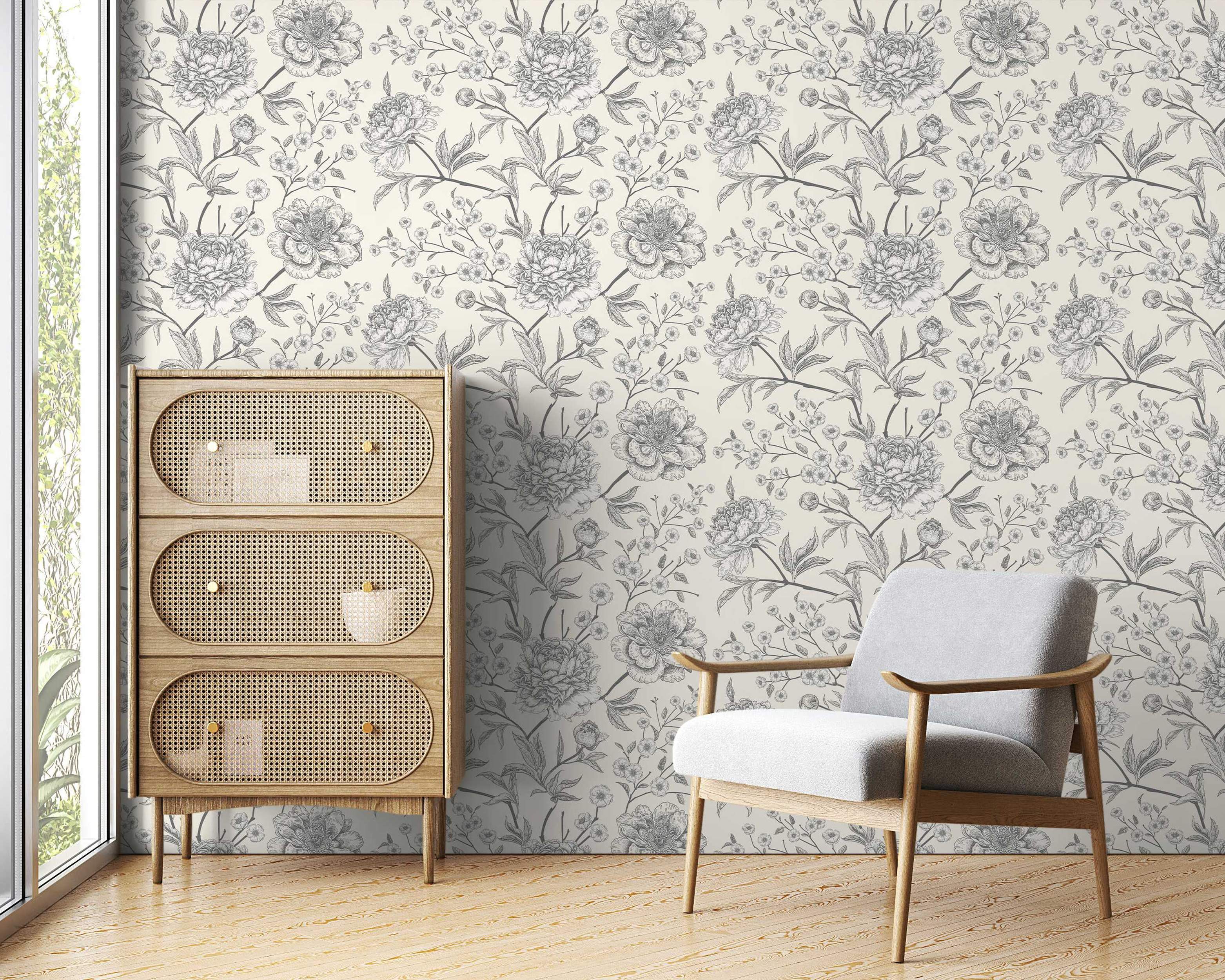 Wallpaper with a sketchy gray floral design featuring peonies and smaller blossoms on a cream background.