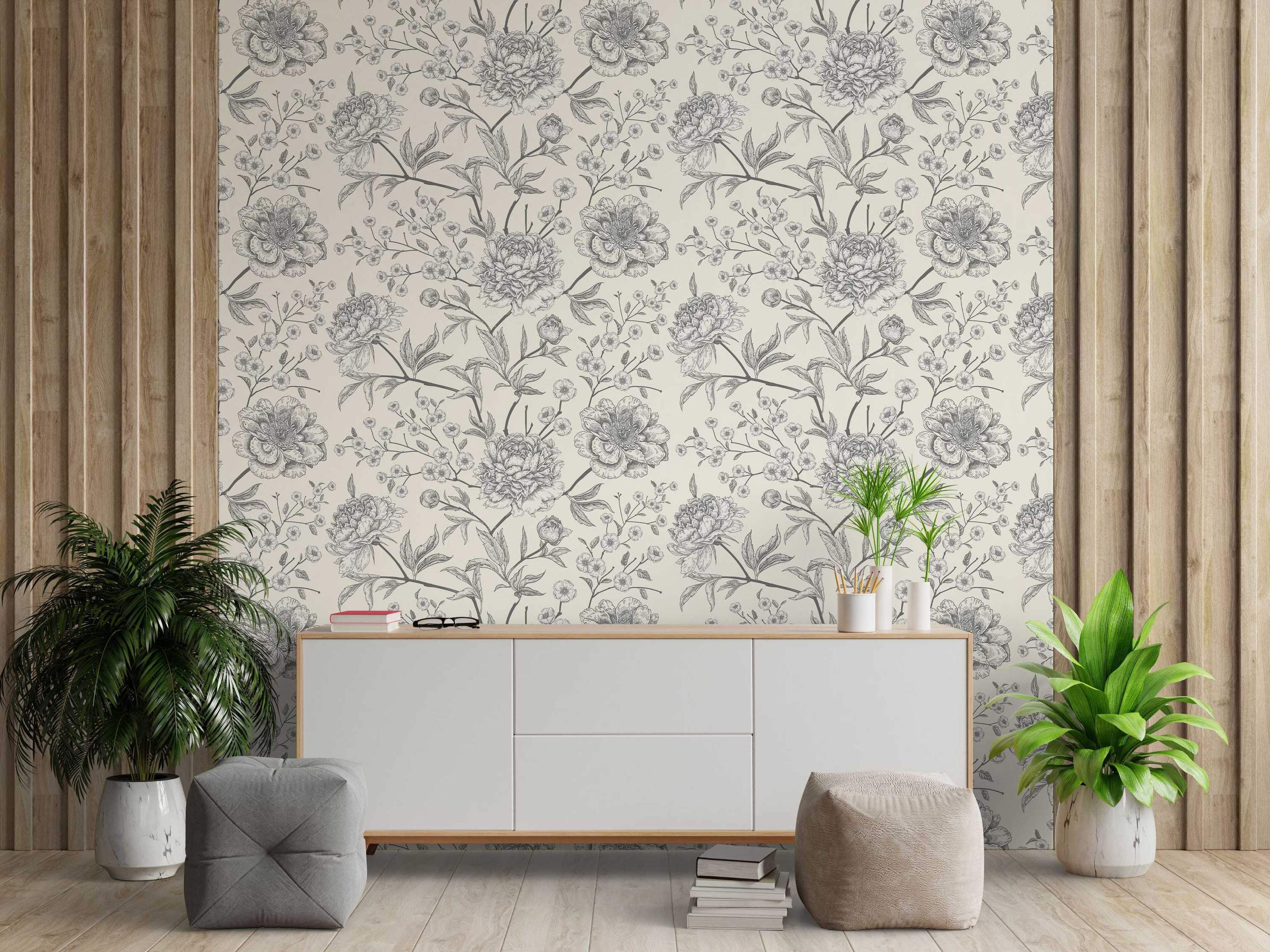Wallpaper featuring a repeating floral pattern of sketched gray peony flowers, smaller blossoms, and leaves on a cream background.