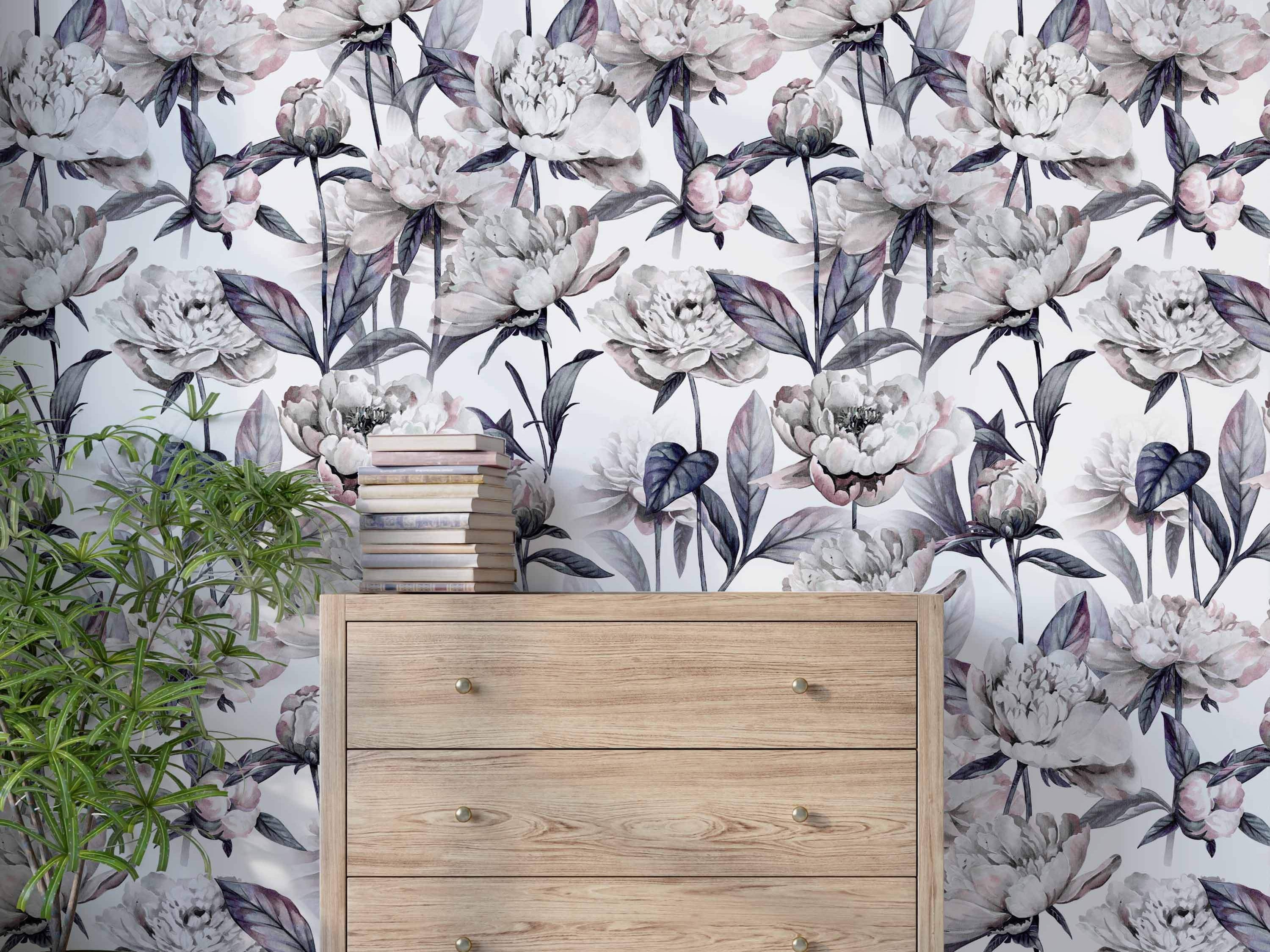 Wallpaper featuring a repeating pattern of large, watercolor-style peonies in white, pale pink, and gray with dark mauve leaves.