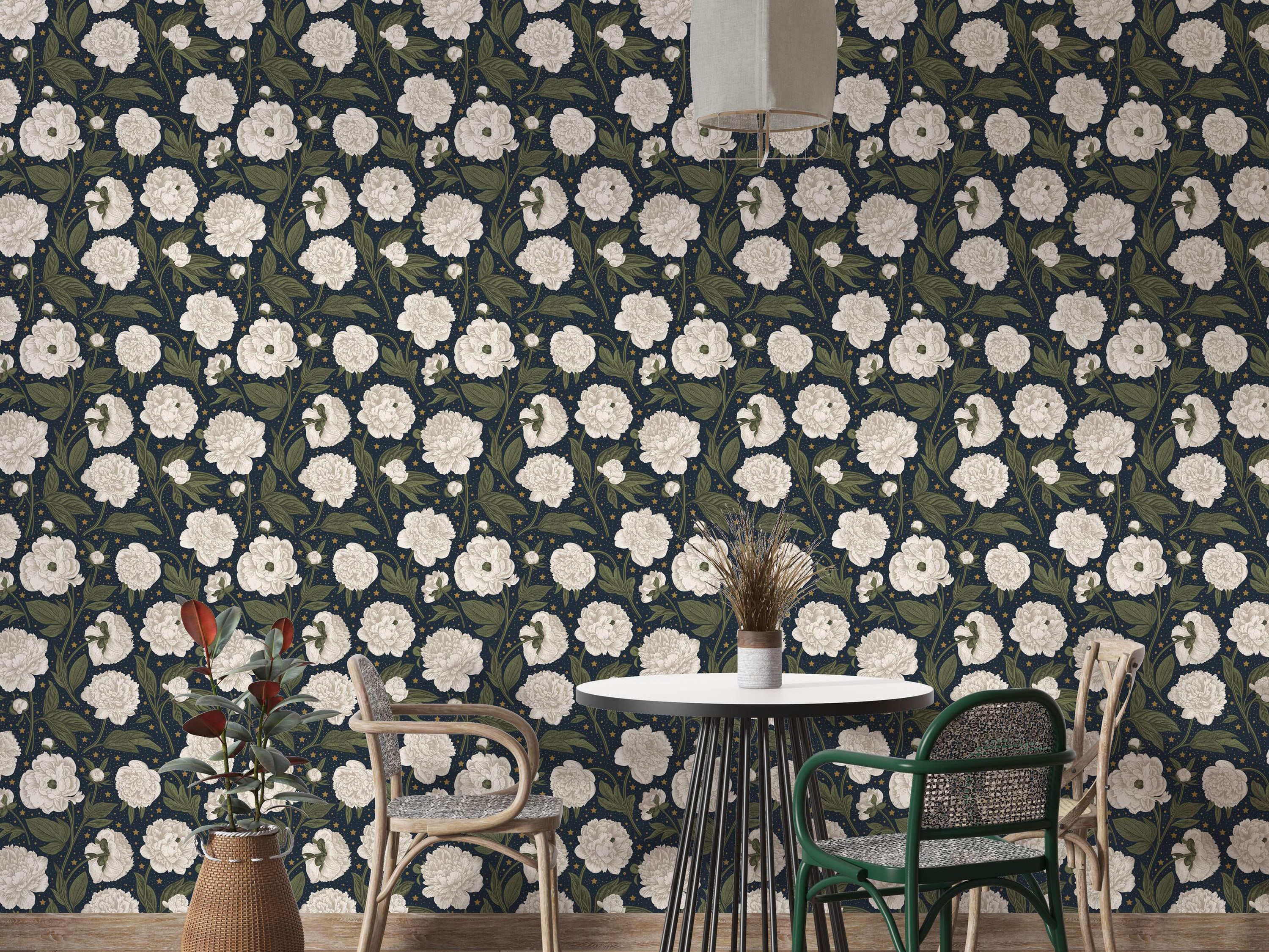 Wallpaper featuring large white peonies and green leaves scattered with tiny yellow stars on a dark navy blue background.