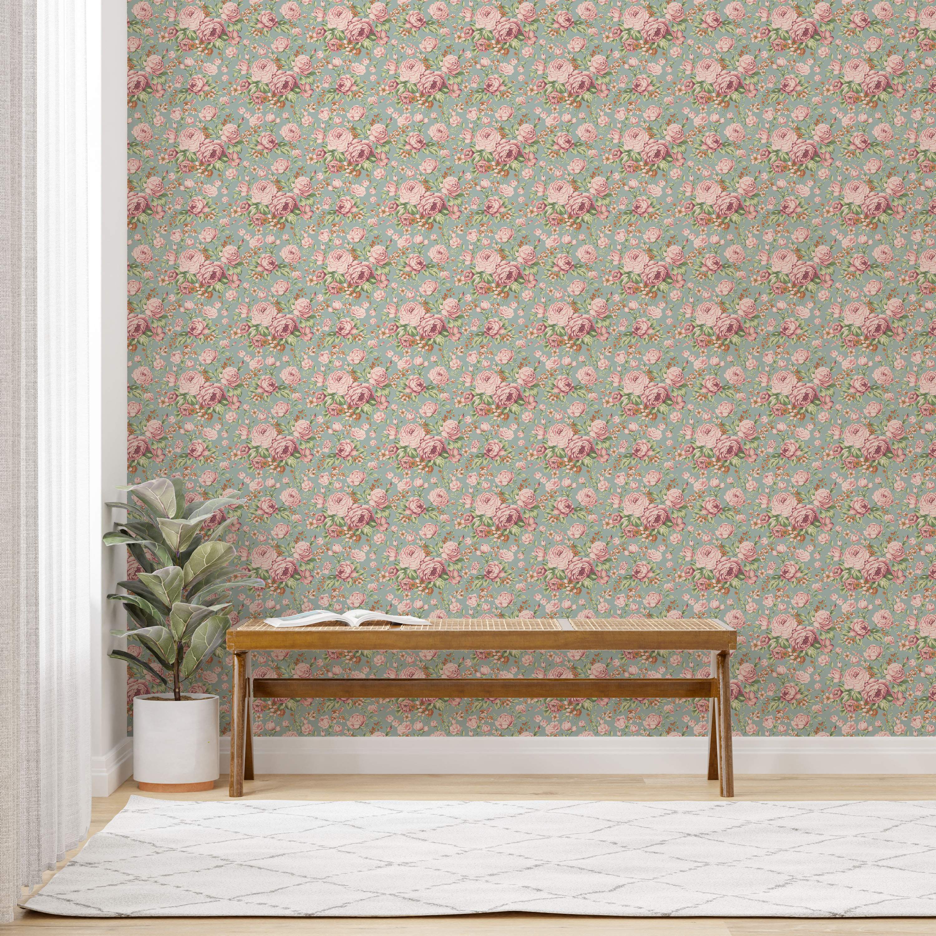 Vintage floral wallpaper with repeating clusters of pink roses and smaller accent flowers on a soft teal background.
