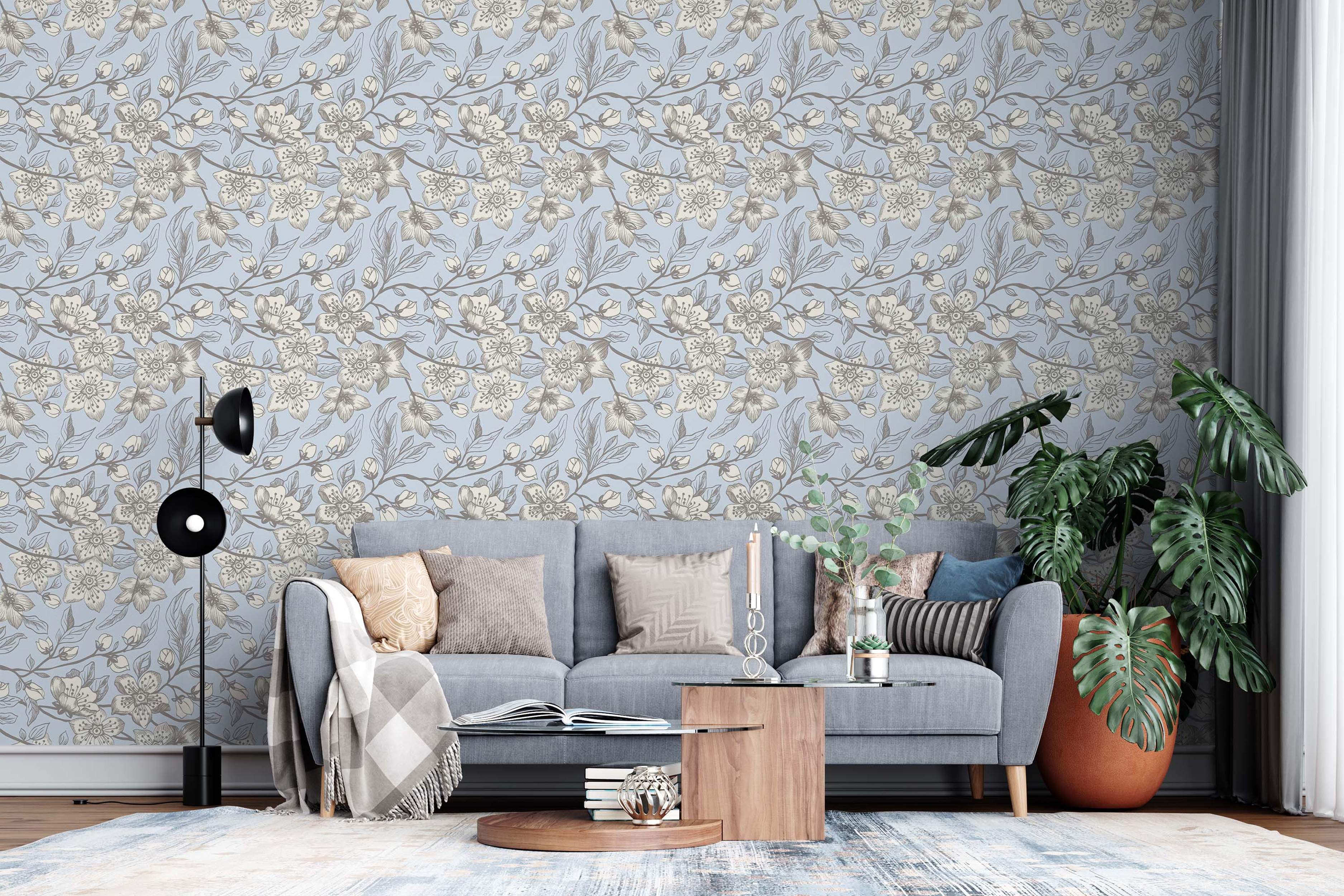 Sketch-style floral wallpaper featuring beige and gray cherry blossoms and buds on winding branches against a light blue background.