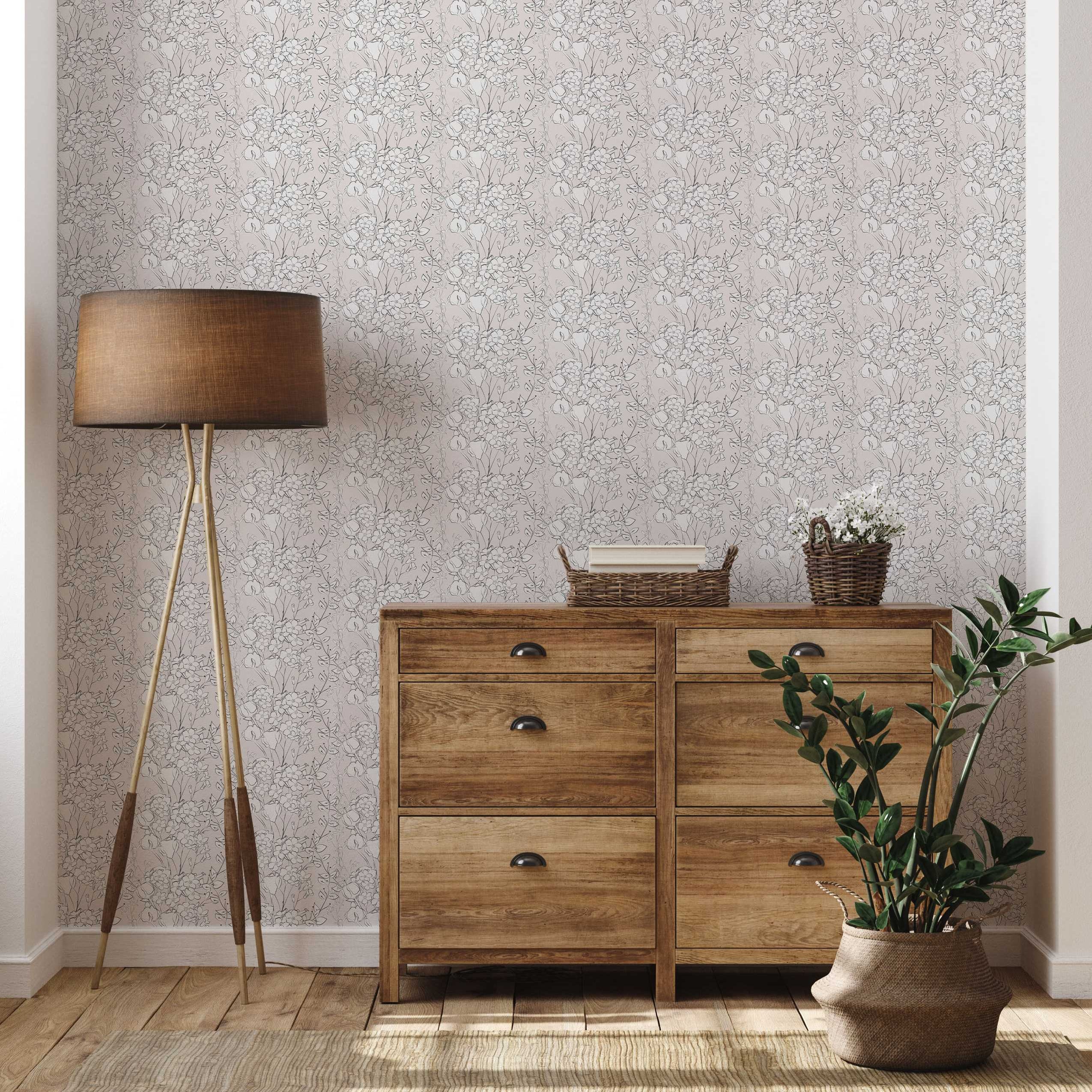 Wallpaper with a repeating sketchy floral pattern in dark grey lines and white fills over a pale pink background, with lighter grey shadow layers.