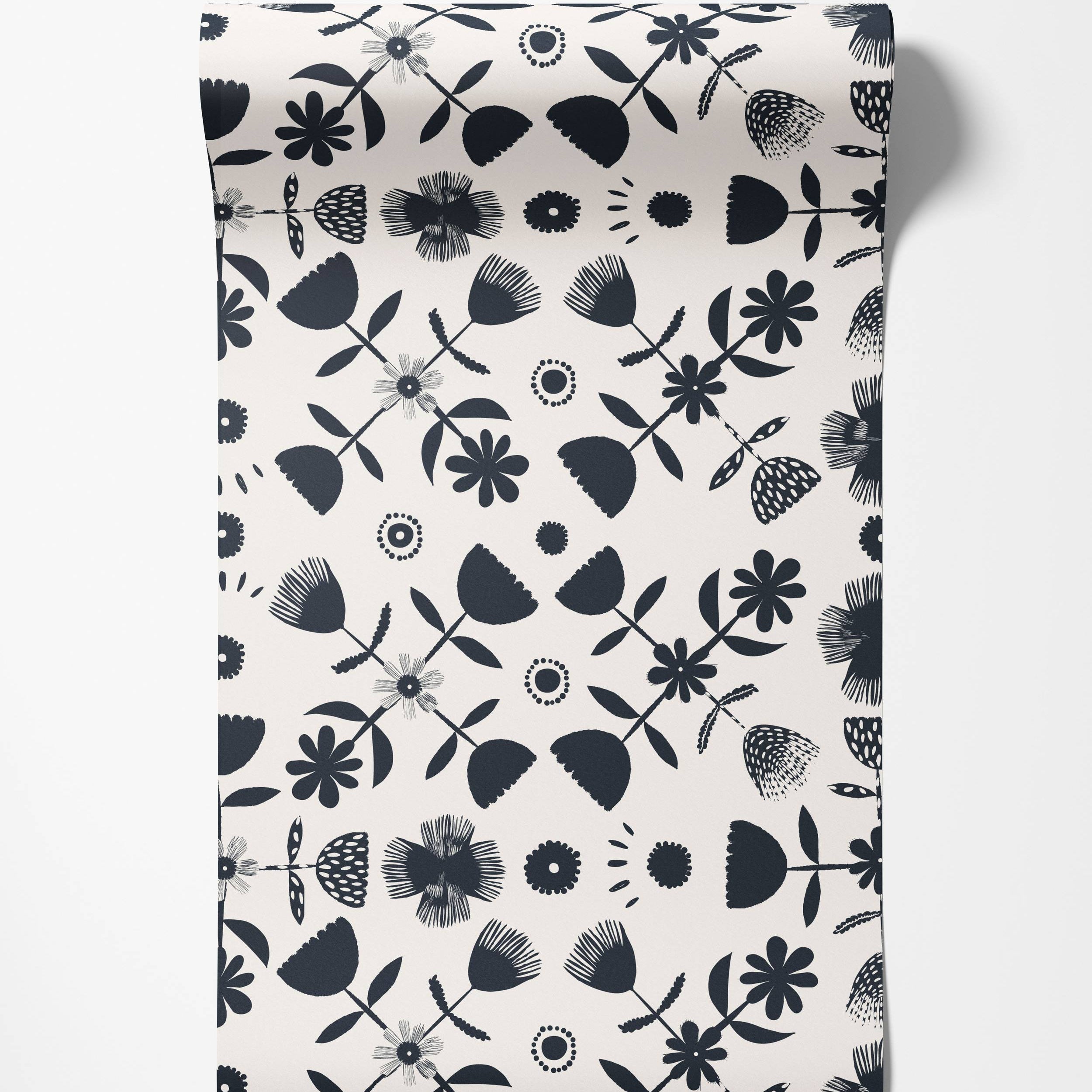 Wallpaper with a Scandinavian-style floral pattern in black silhouettes on an off-white background, featuring various stylized flowers.