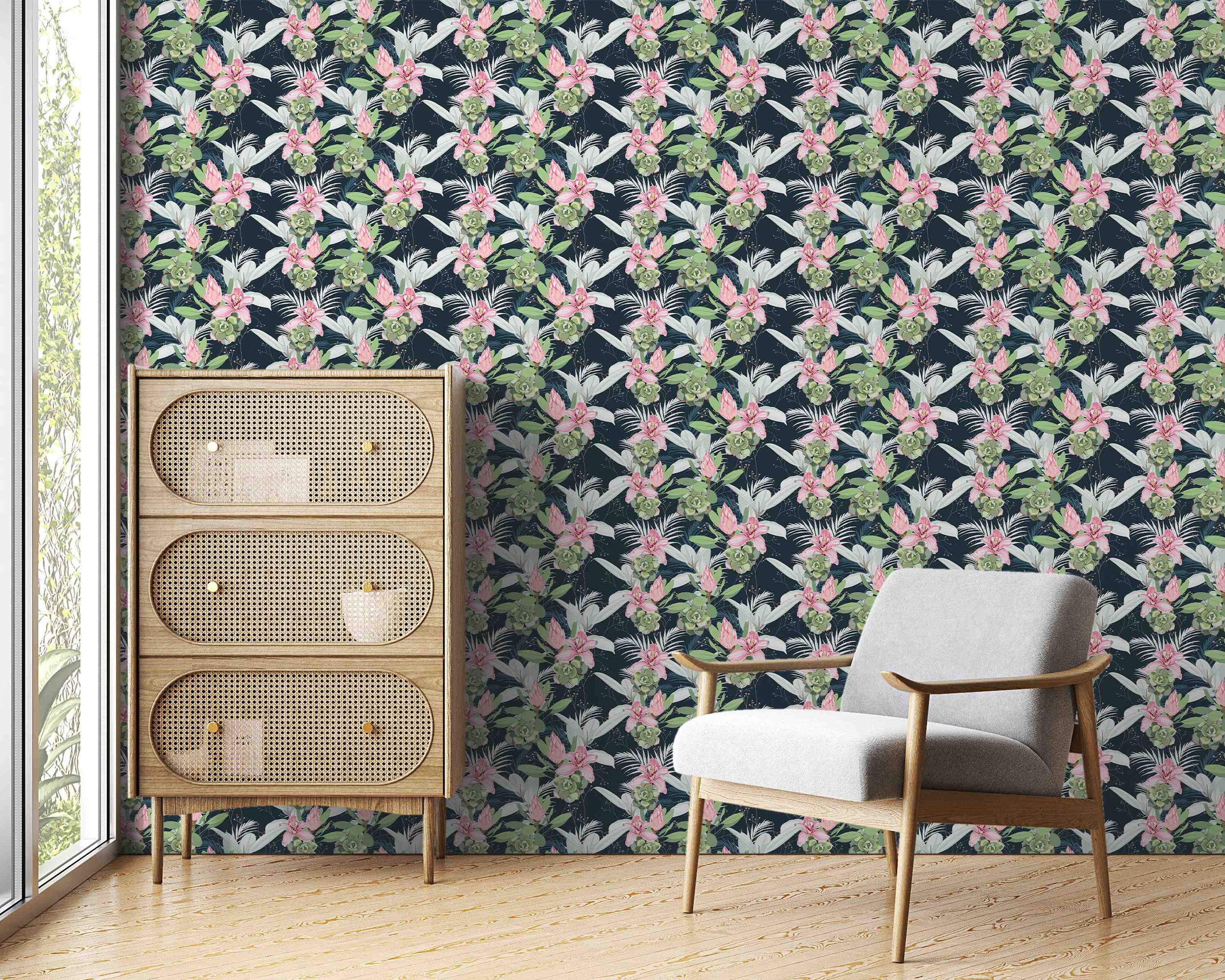 Wallpaper featuring repeating diagonal clusters of pink lilies, green succulents, and white leaves on a dark navy blue background.