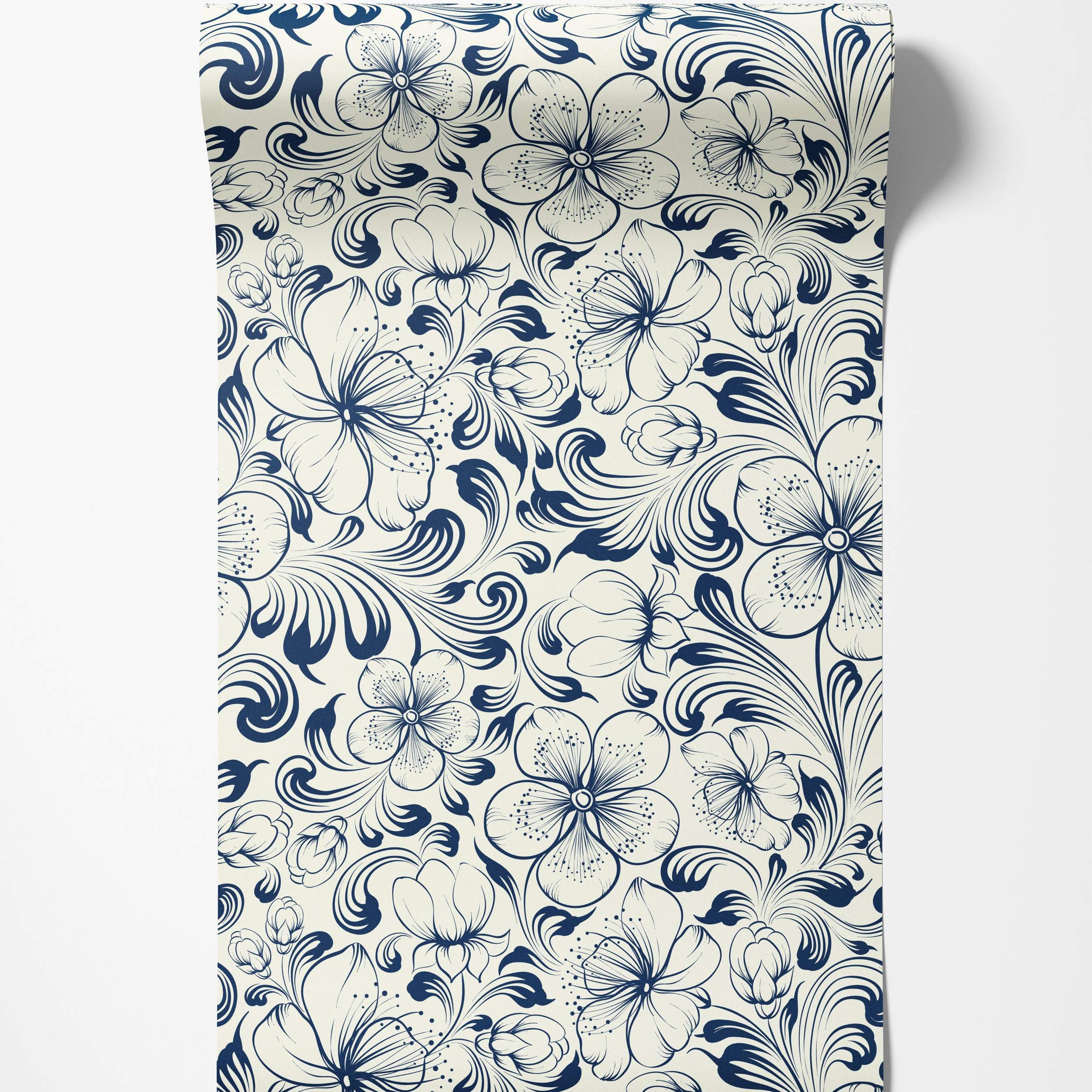Blue stylized floral vine wallpaper with swirling leaves and flowers detailed with linework on a cream background.