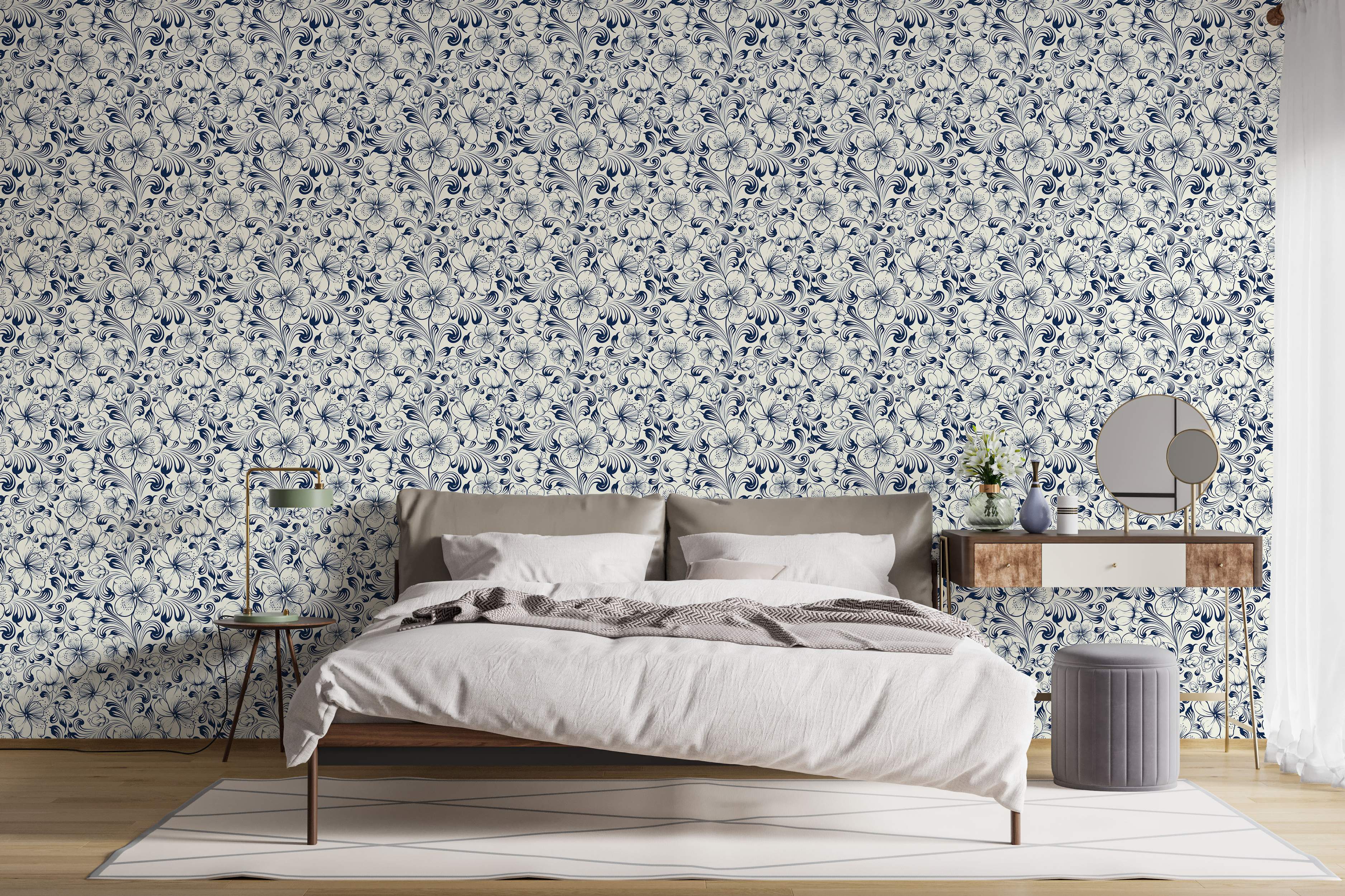 Elegant wallpaper featuring intricate dark blue floral motifs and swirling vines on a cream background.