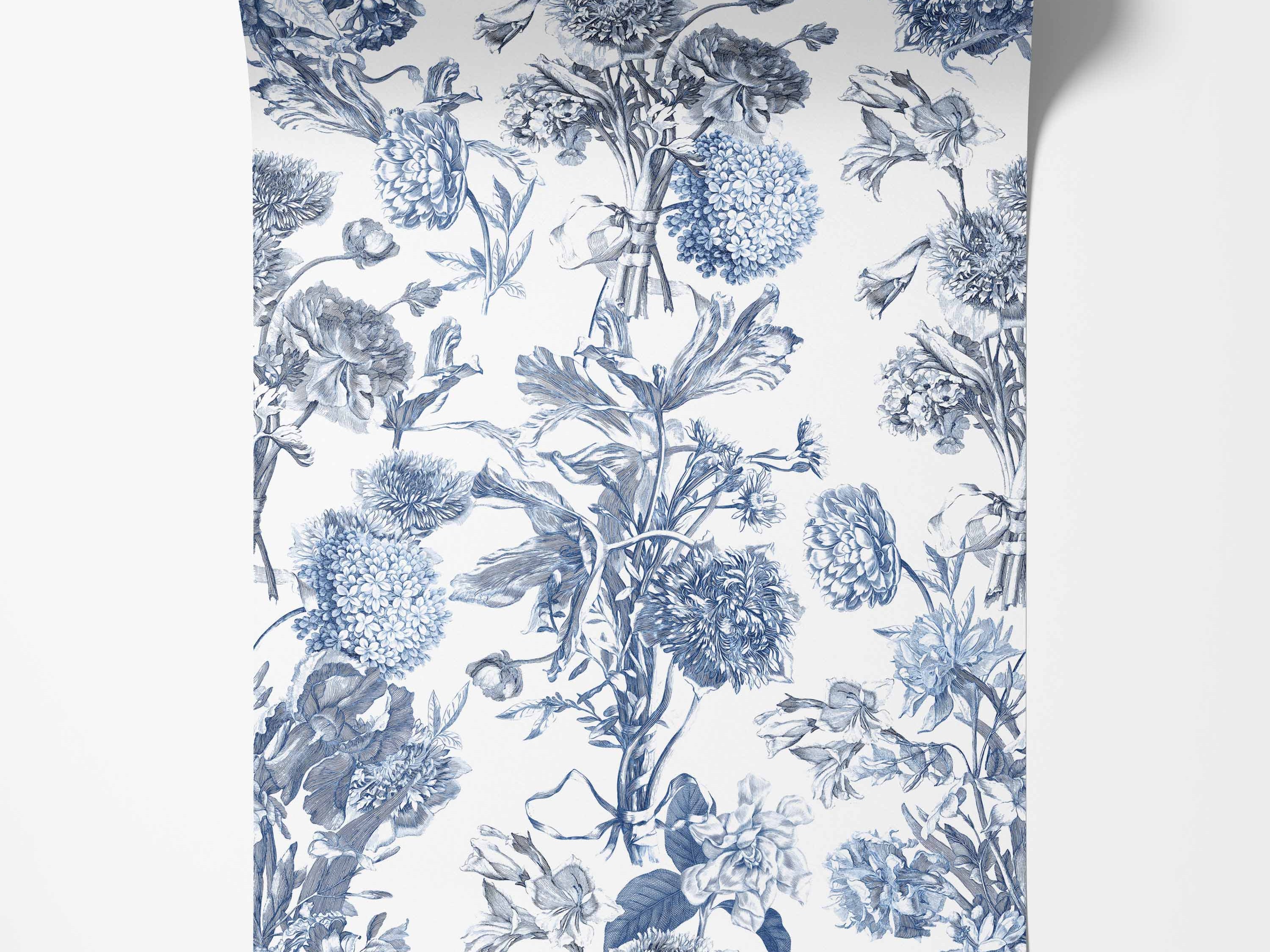 Vintage floral toile wallpaper with detailed blue botanical illustrations of various flowers arranged vertically on a white background.