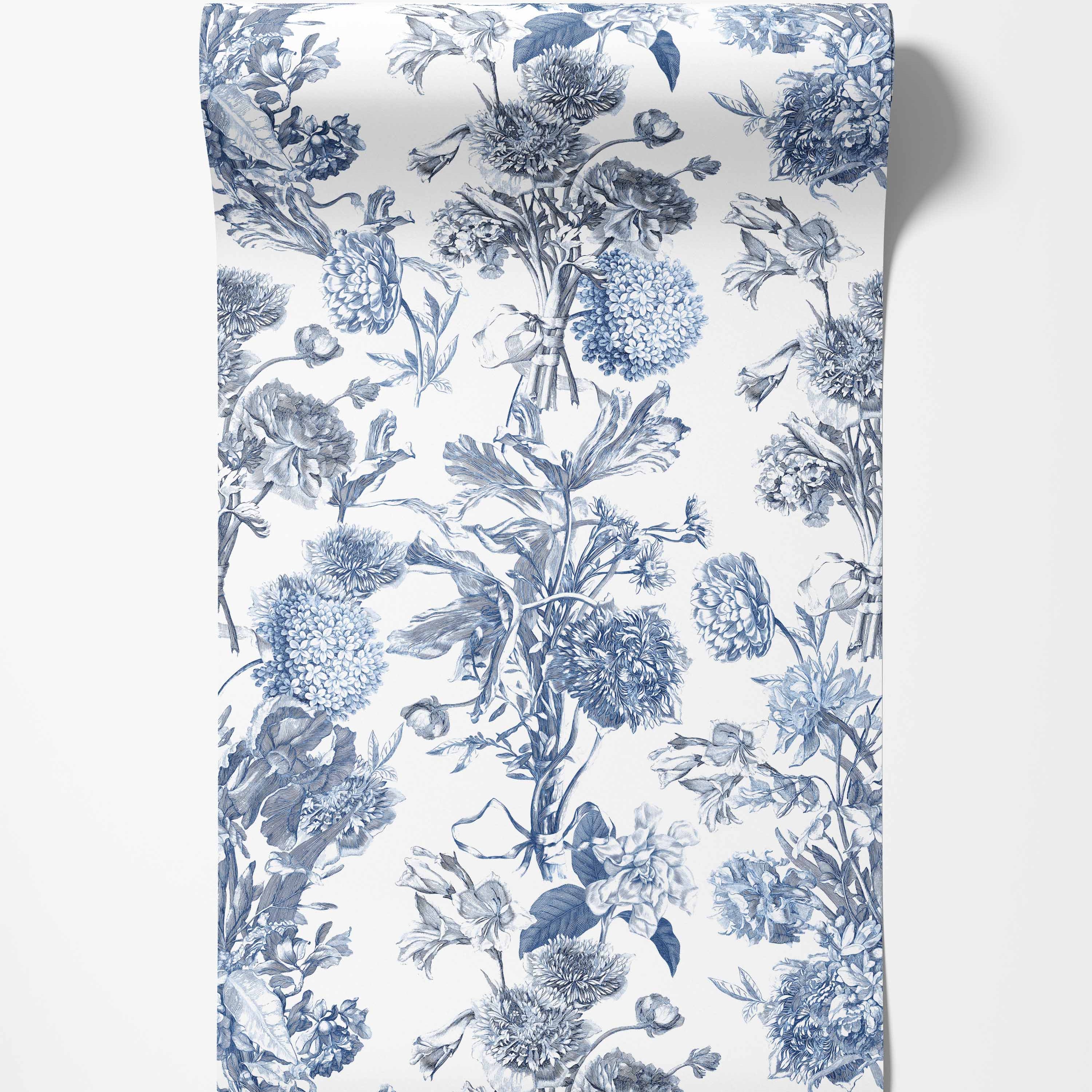 Vintage floral toile wallpaper with detailed blue botanical illustrations of various flowers arranged vertically on a white background.