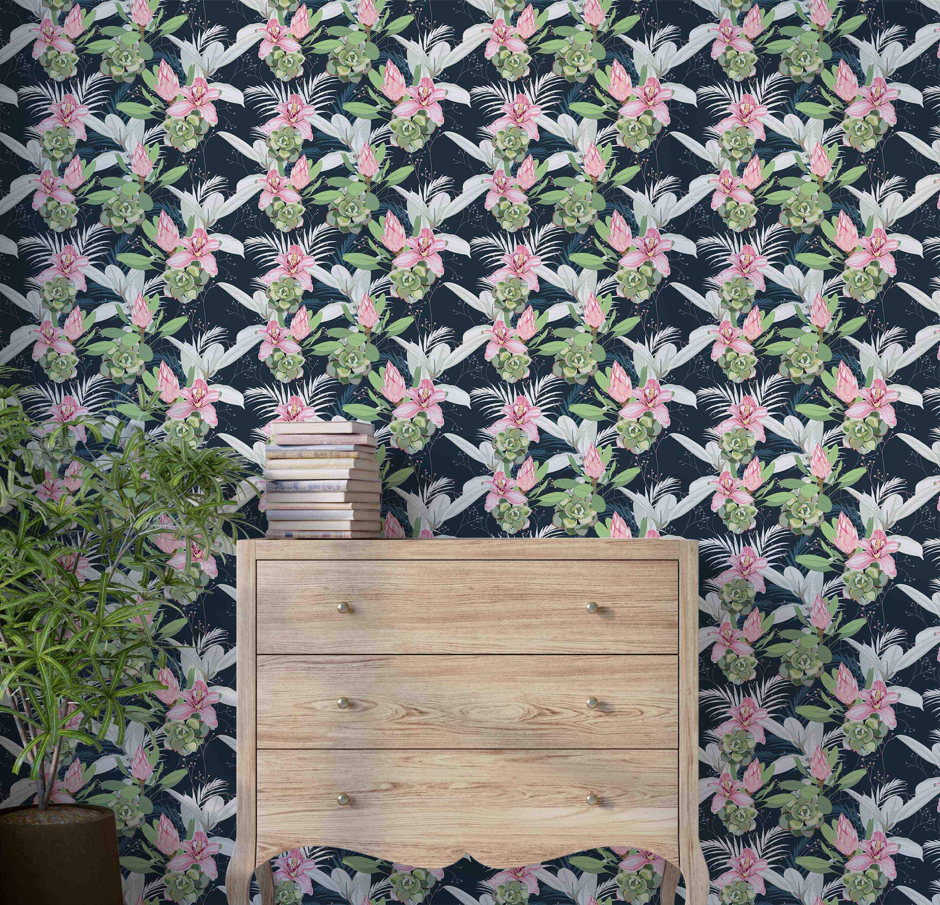 Botanical wallpaper with a repeating pattern of pink orchids, protea, green succulents, and white leaves on a dark blue field.