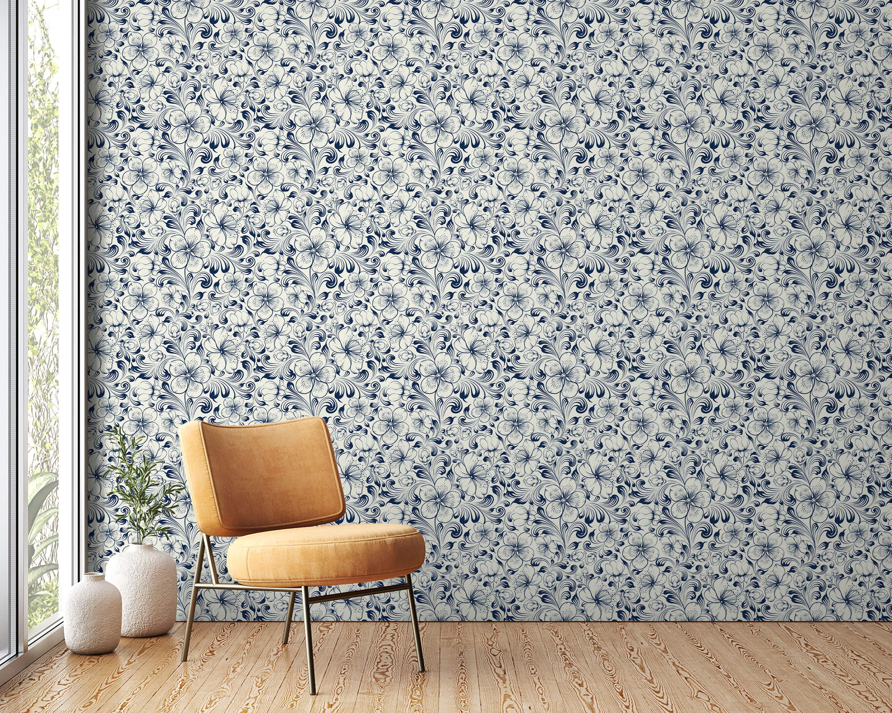 Intricate floral wallpaper featuring navy blue outlined flowers and swirling vines on a cream background.