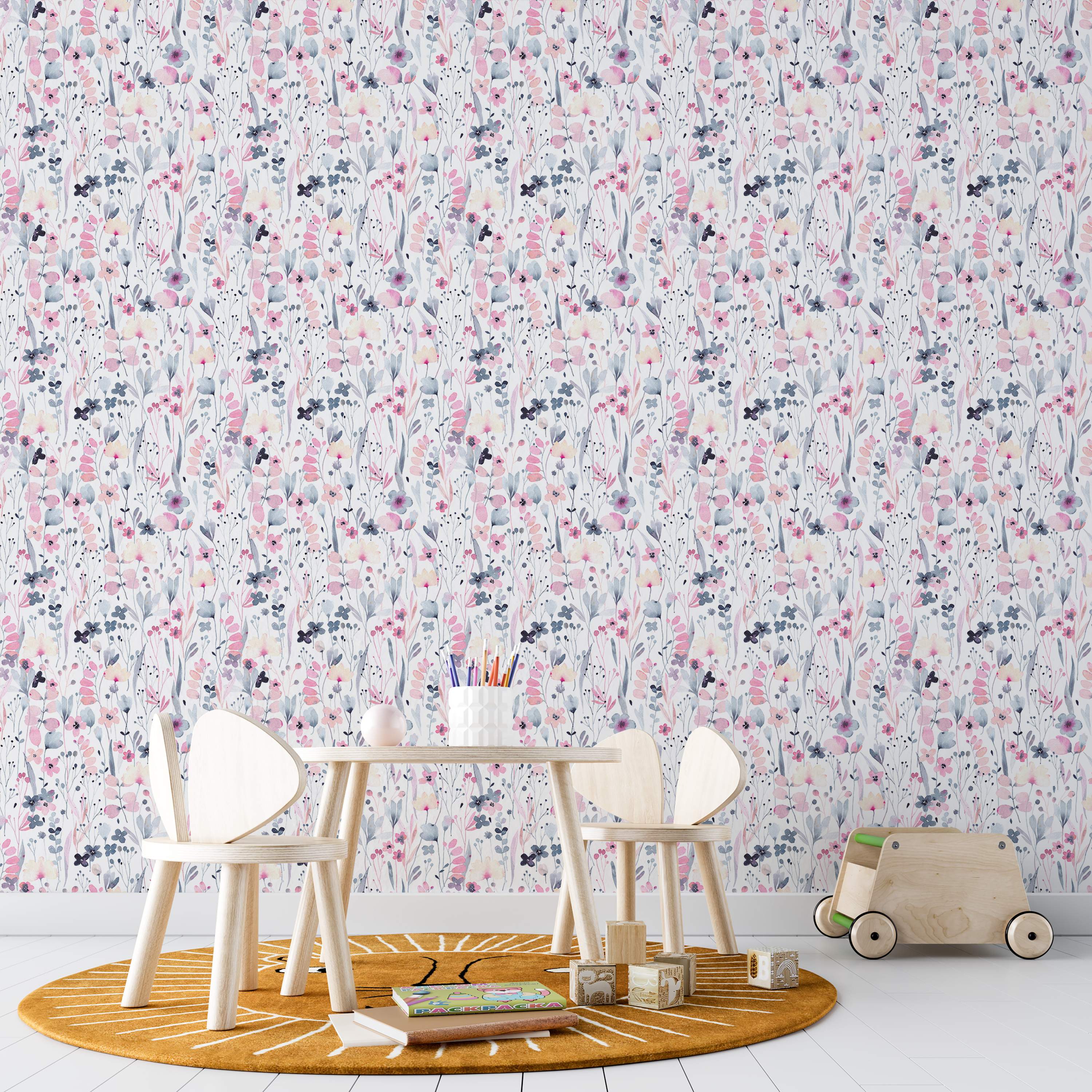 Delicate watercolor floral wallpaper with pink, grey-blue, and pale yellow flowers and leaves scattered on a white field.