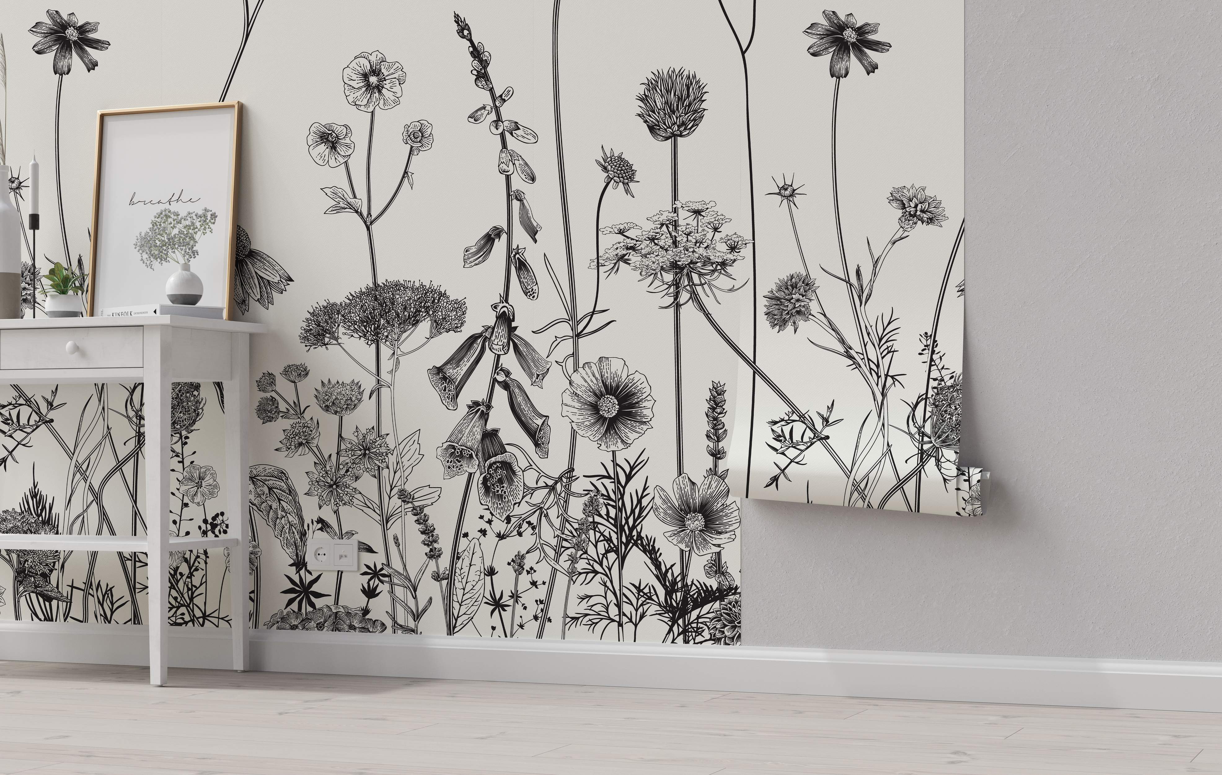 Black botanical line drawing wallpaper featuring assorted wildflowers like poppies and foxgloves on an off-white background.