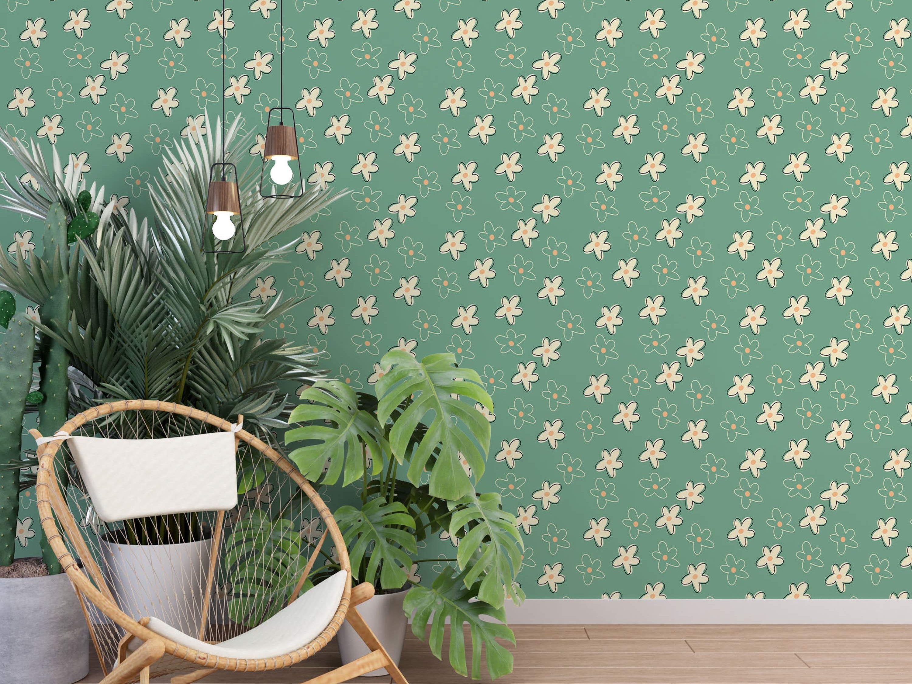 Wallpaper featuring scattered, simple cream flowers with orange centers and coordinating teal outlines on a teal green background.