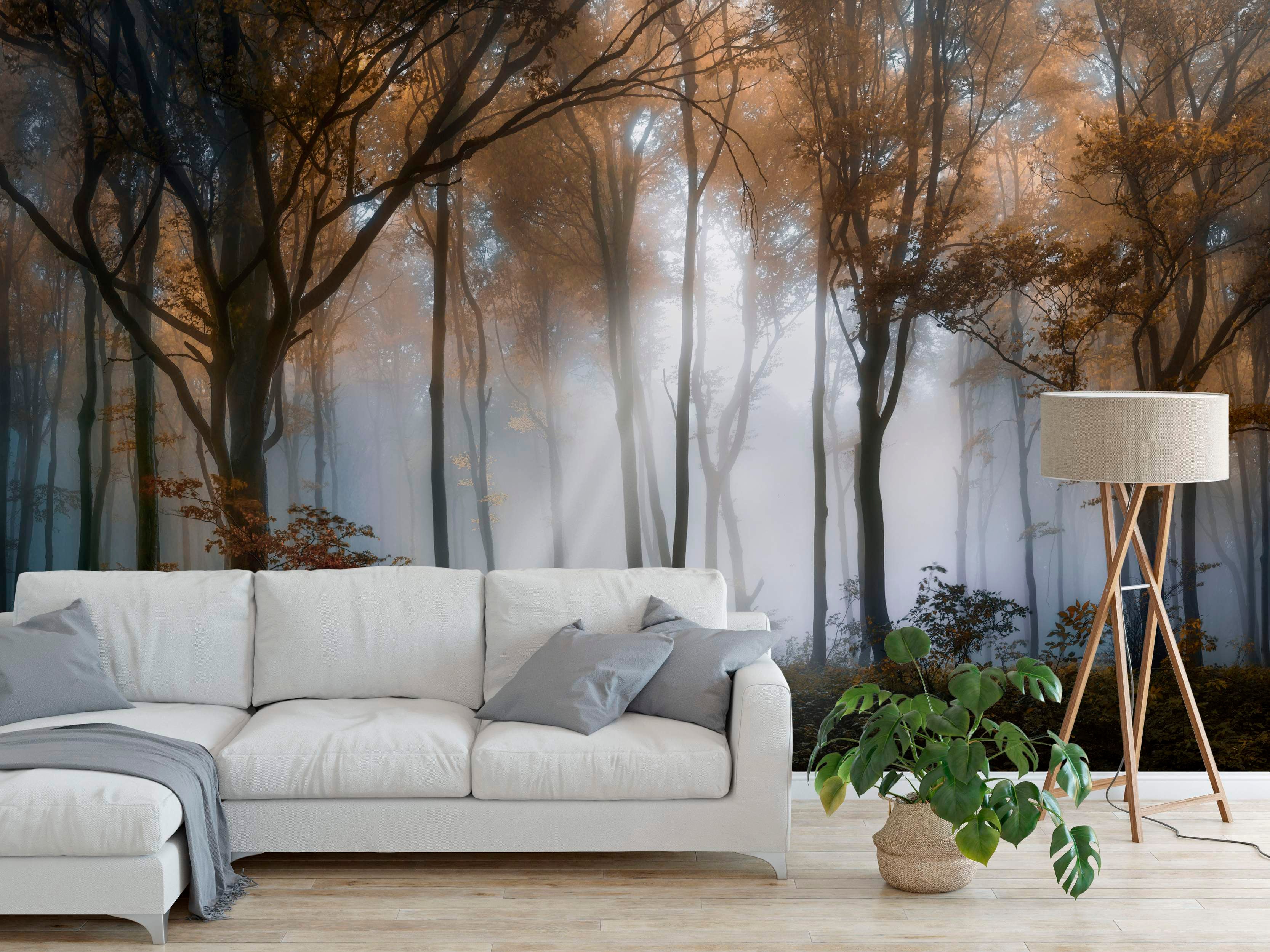 Mural depicting a foggy autumn forest scene with tall trees, orange-brown leaves, and sunlight filtering through the mist.