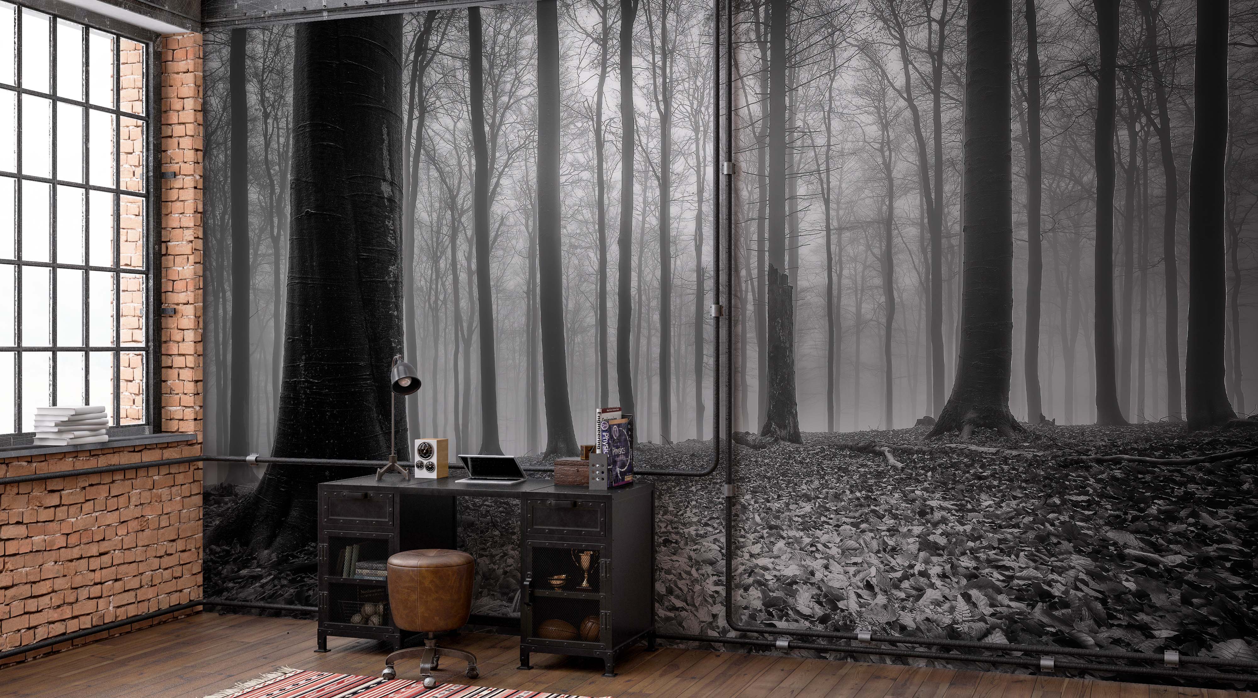 A black and white mural depicting a dense, foggy forest with tall, bare trees and a leaf-covered ground.