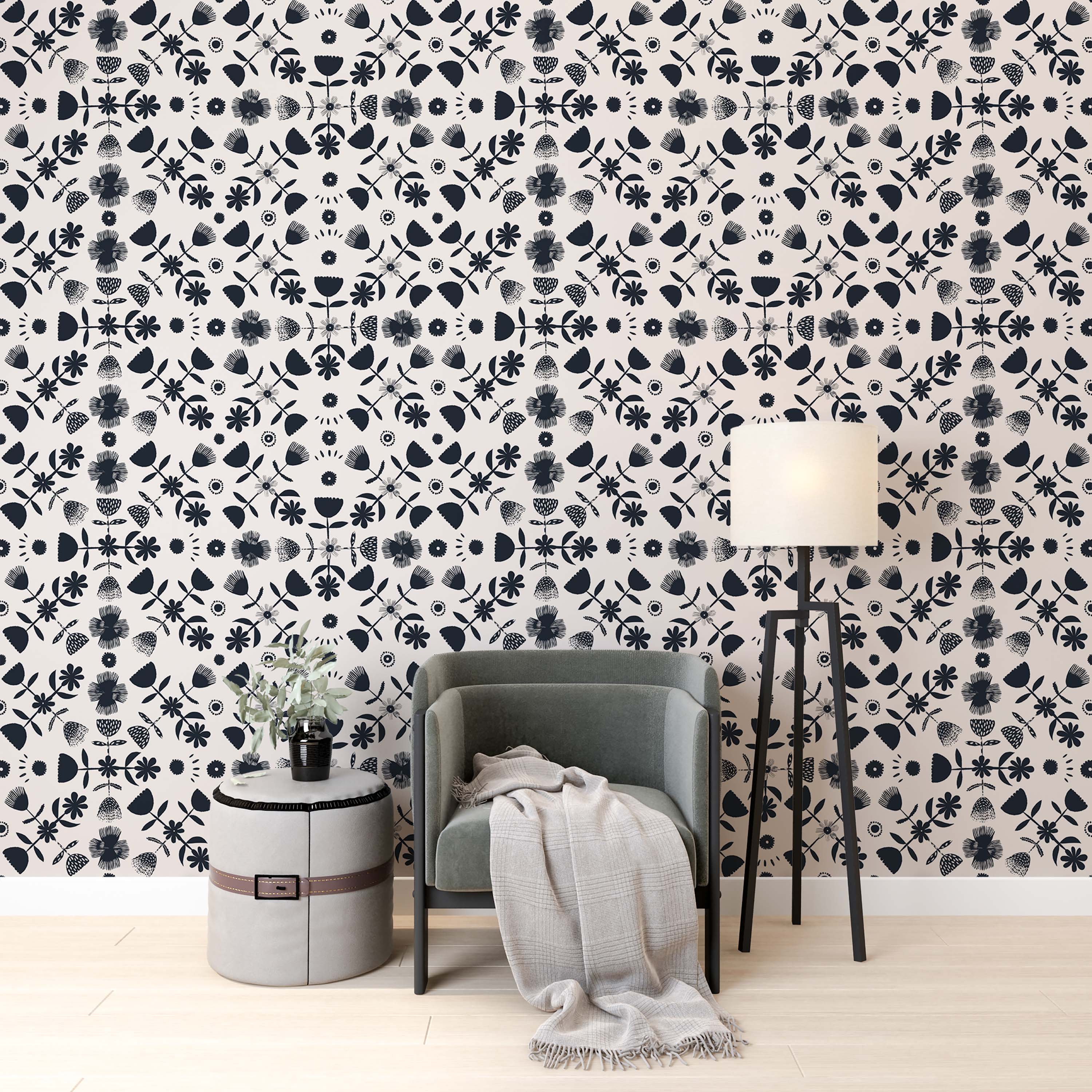 Folk art wallpaper with repeating stylized navy blue floral and botanical motifs on a cream background.