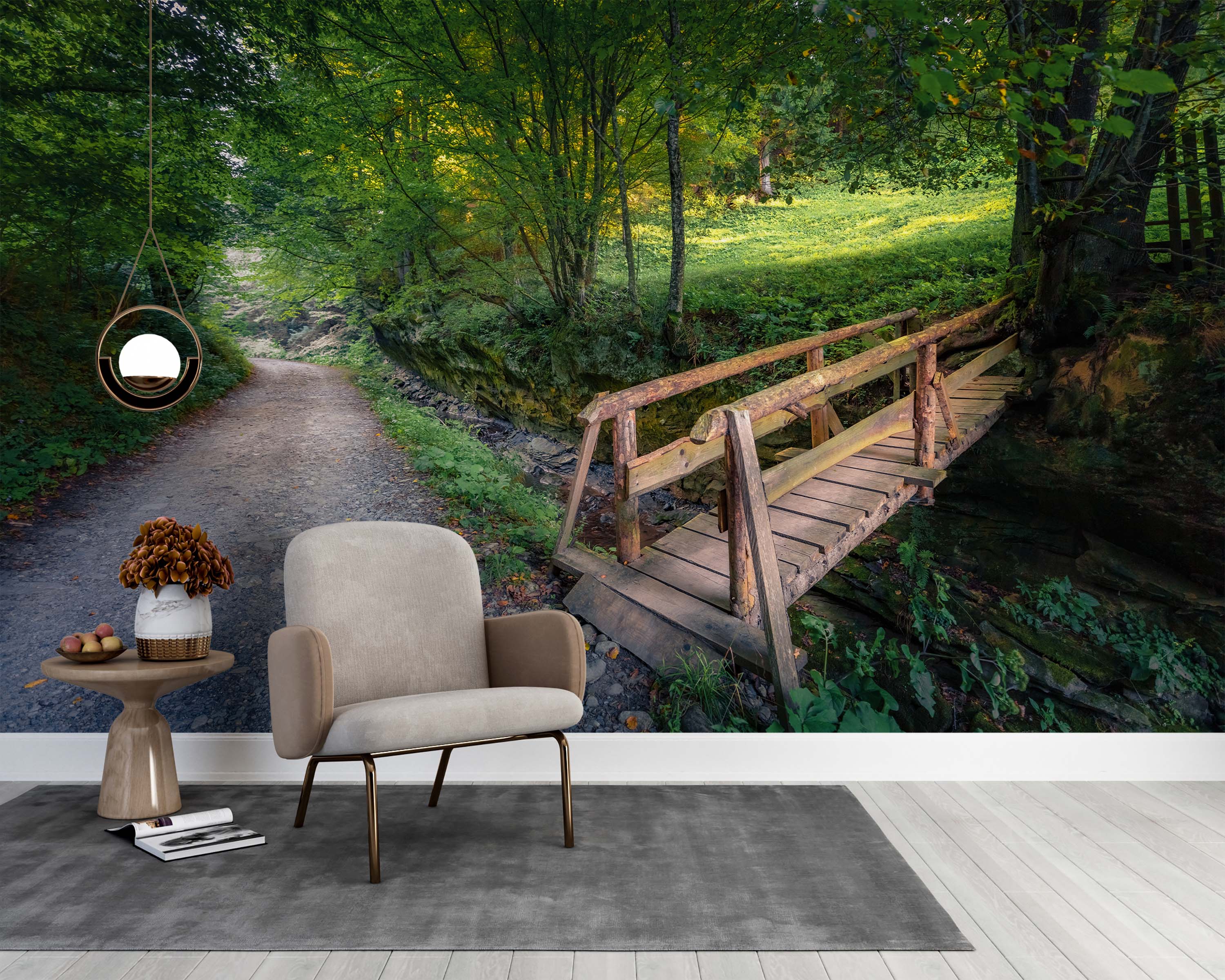 A serene forest mural showing a rustic wooden bridge over a creek, with a path leading through lush green trees.