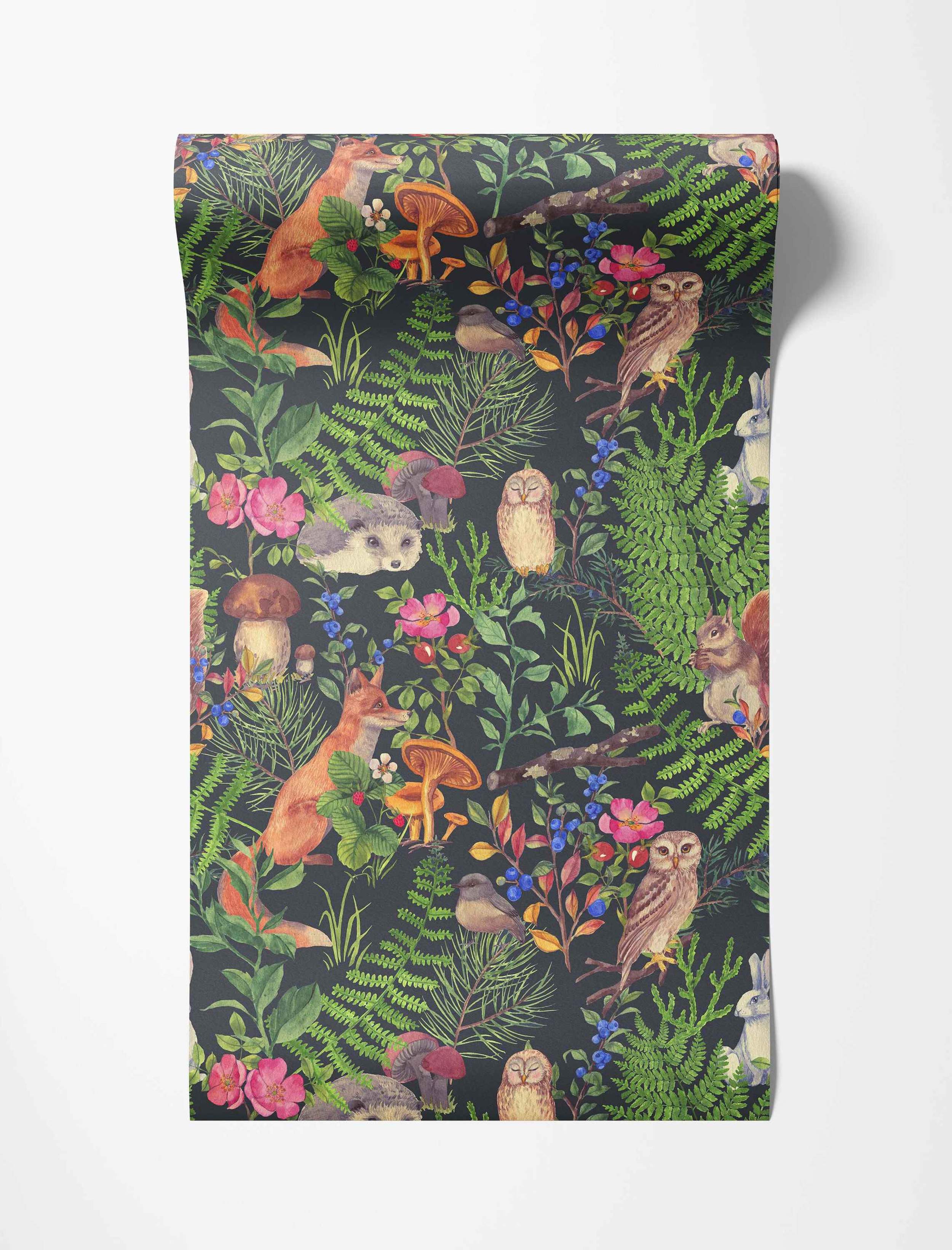 Illustrated woodland wallpaper featuring foxes, owls, squirrels, hedgehogs, and plants in greens, browns, and pinks on dark gray.