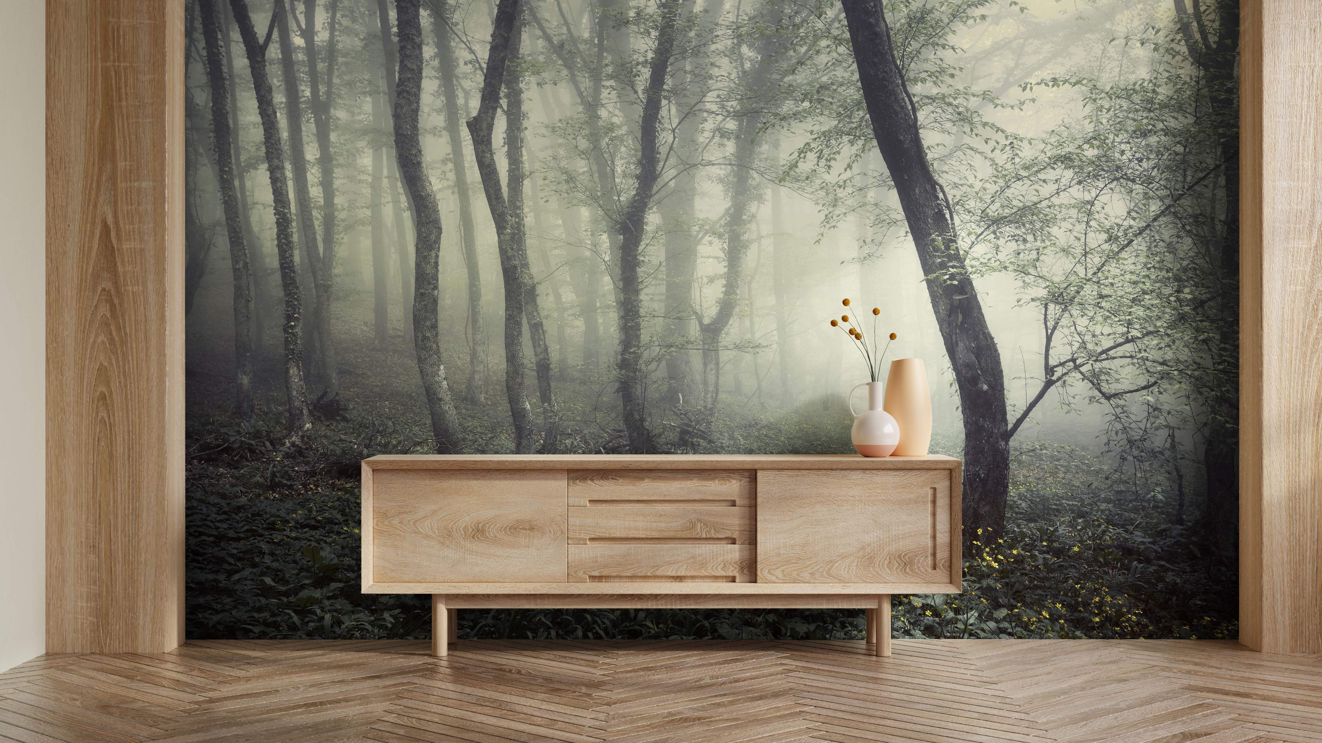 Photographic mural depicting a misty, dense forest with tall trees in muted green and gray tones.