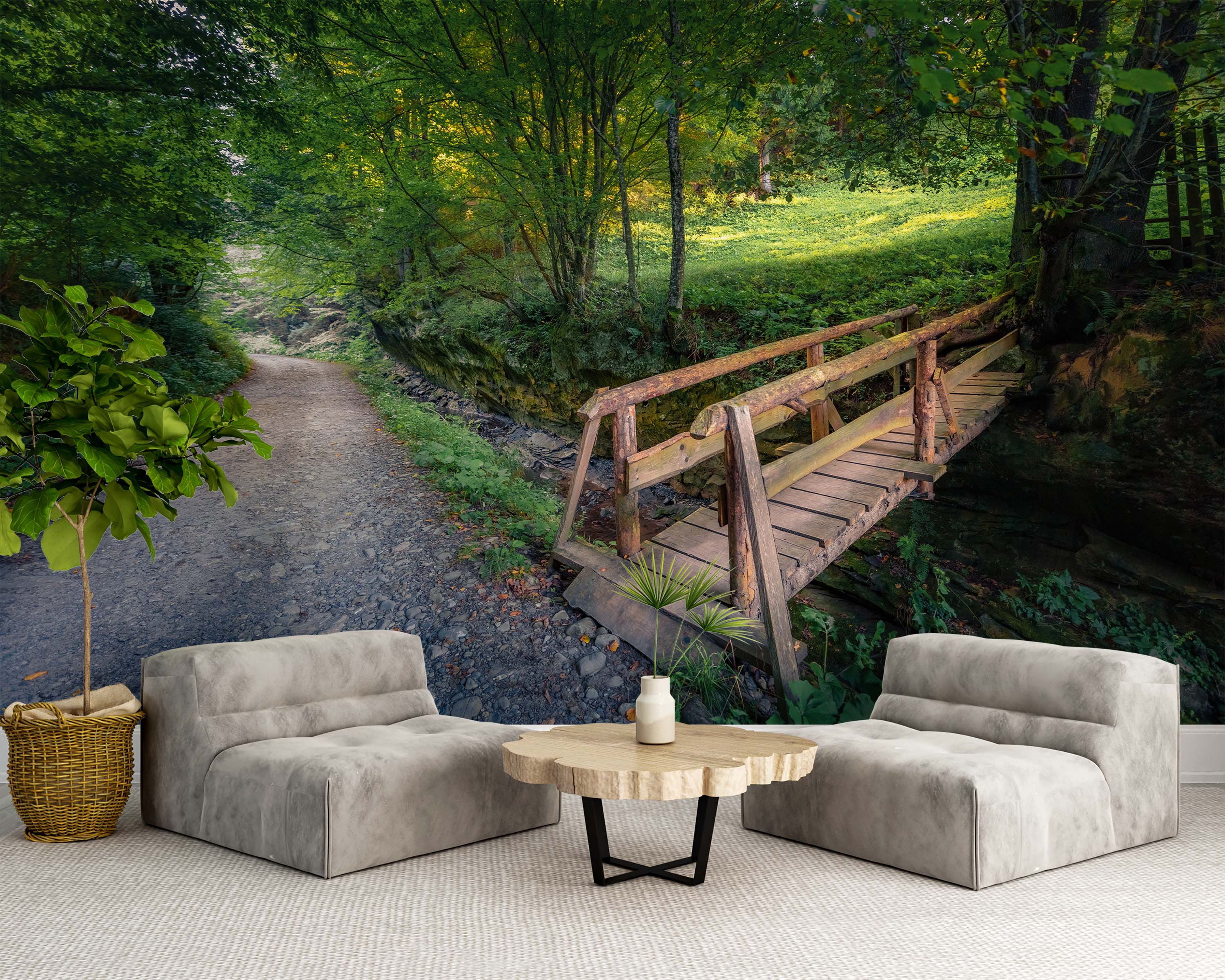 A scenic forest mural depicting a rustic wooden bridge over a creek, with a dirt path leading into lush green woods.