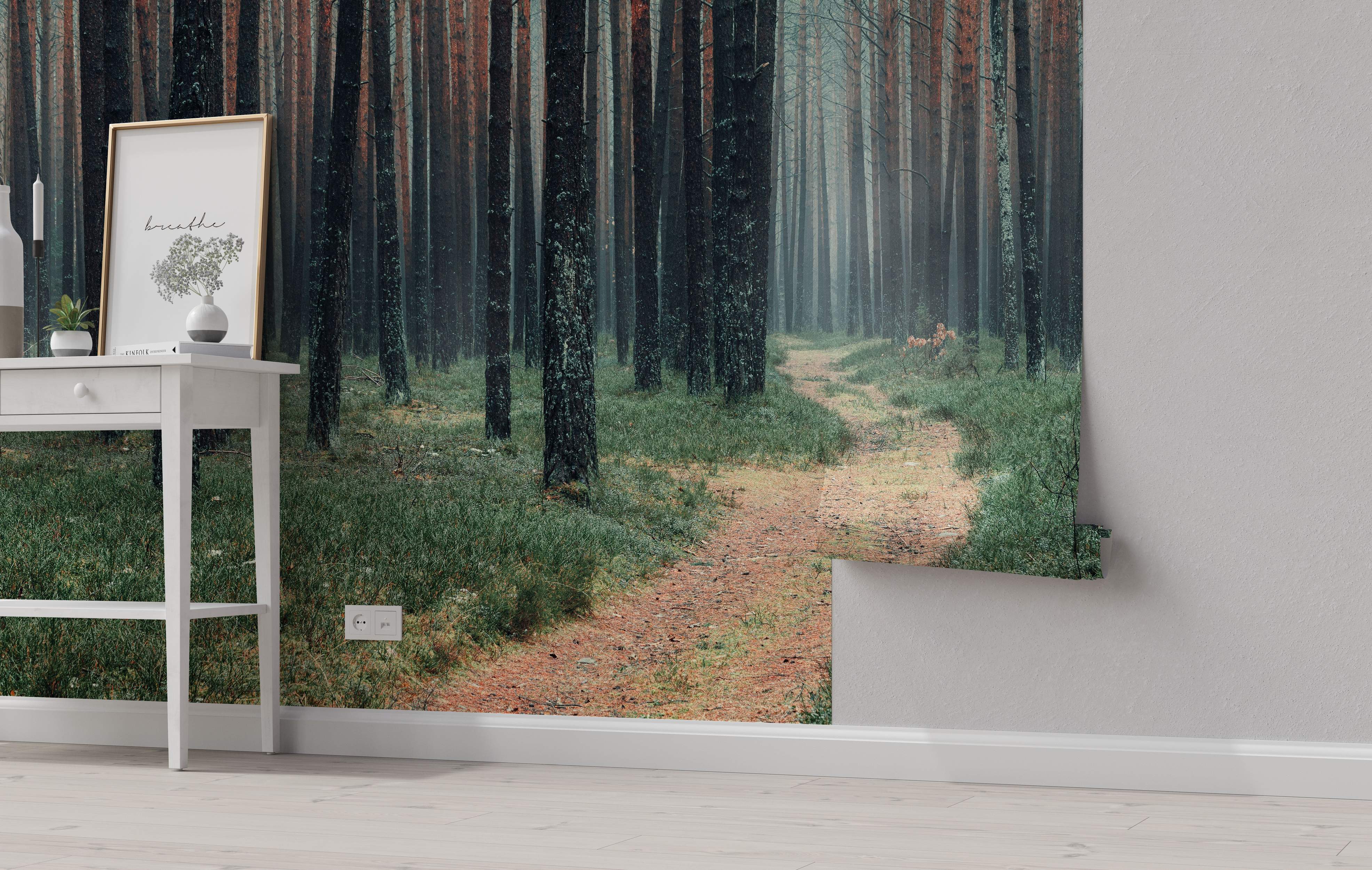 Mural depicting a winding dirt path through a dense, misty forest with tall, dark tree trunks and green undergrowth.