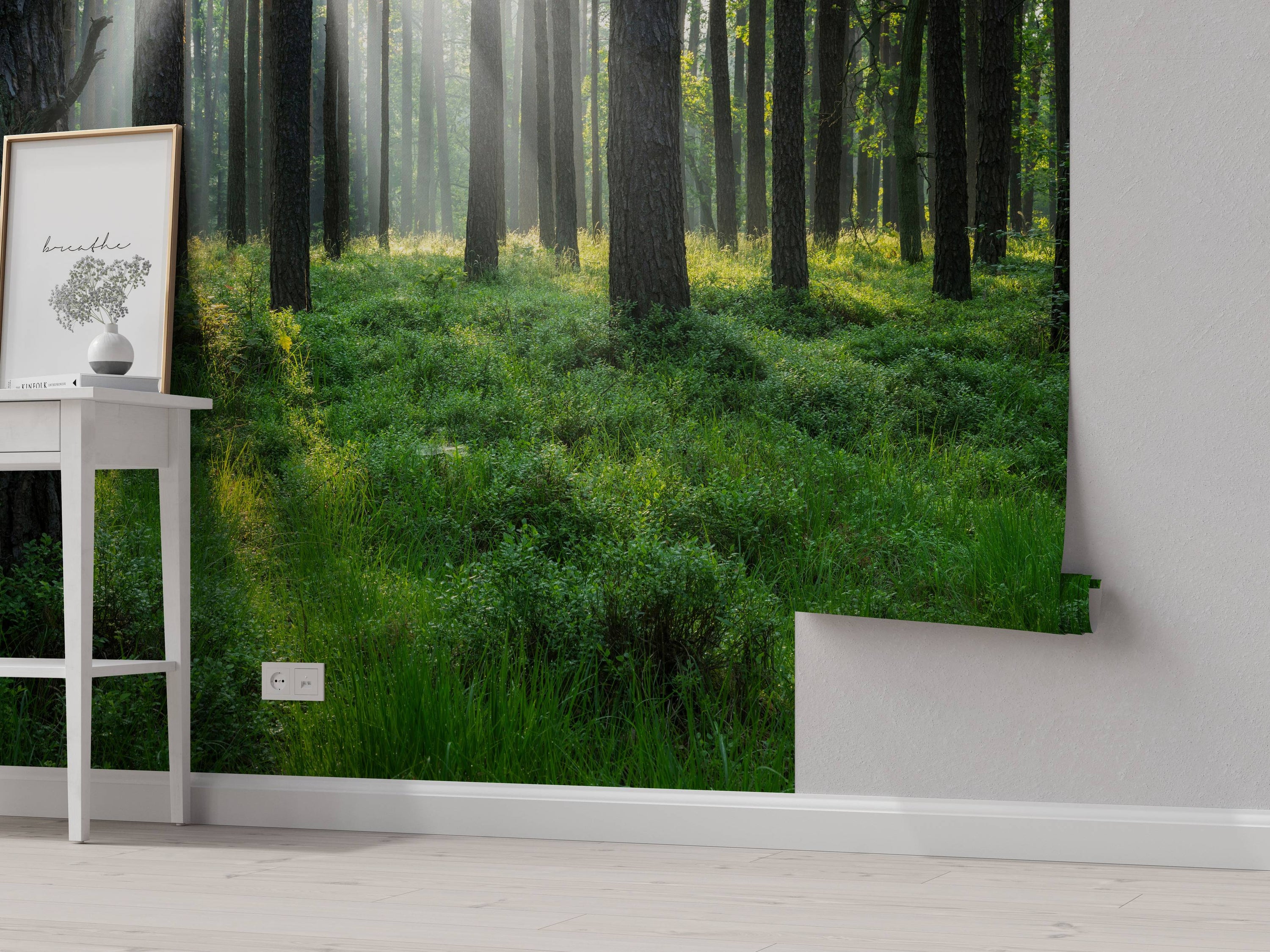 A photorealistic wall mural of a tranquil forest, with bright sunbeams filtering through tall trees onto a lush green ground.