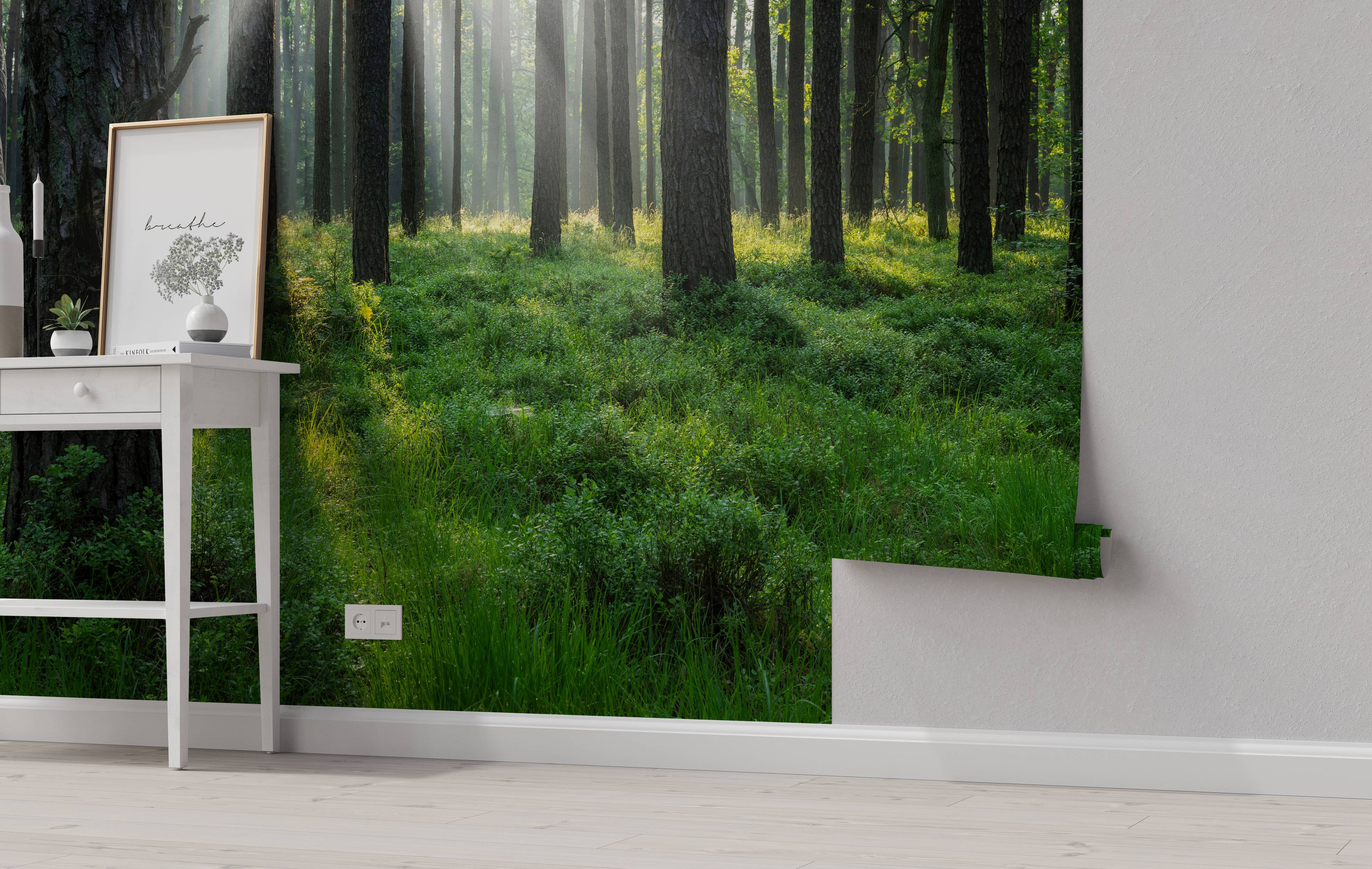 A photorealistic wall mural of a tranquil forest, with bright sunbeams filtering through tall trees onto a lush green ground.