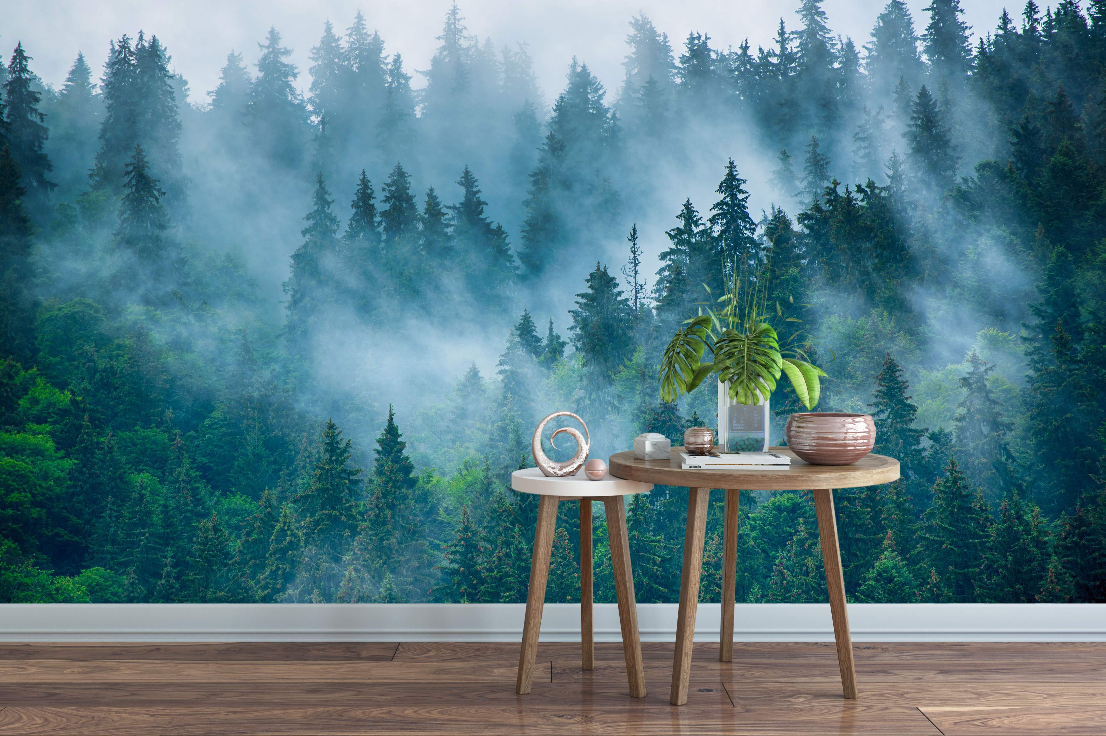 Mural depicting a dense green pine forest landscape enveloped in swirling blue-gray mist, creating depth and atmosphere.