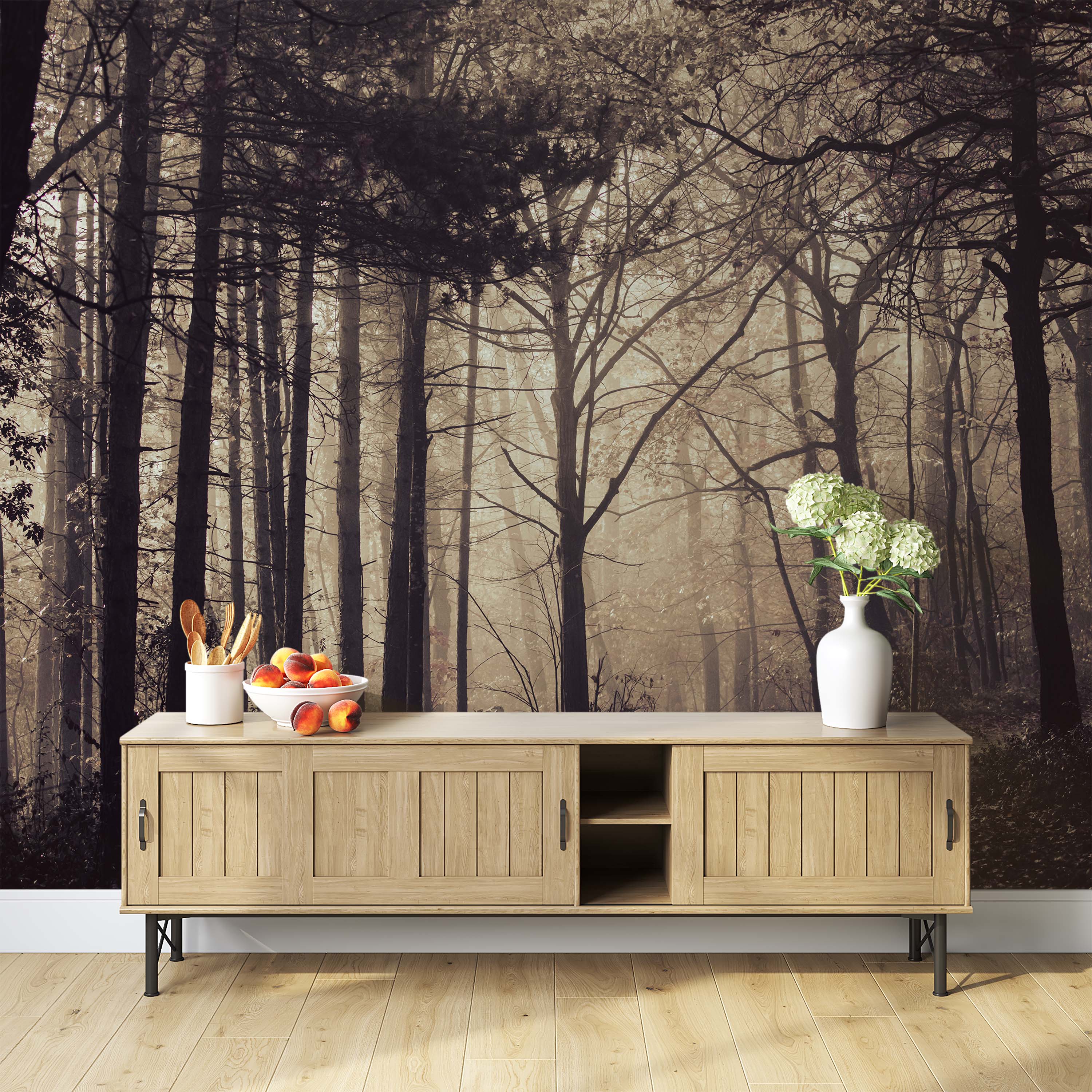 A photographic mural of a dense, foggy forest in monochromatic sepia tones, creating a sense of depth and mystery.