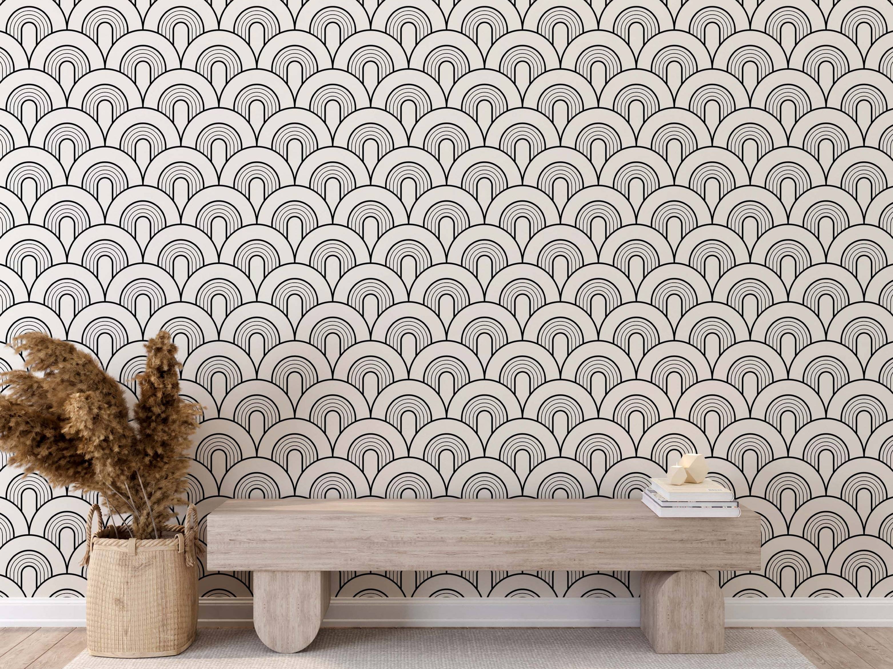 Geometric wallpaper featuring repeating black outlined nested arches on an off-white background, forming a scale pattern.