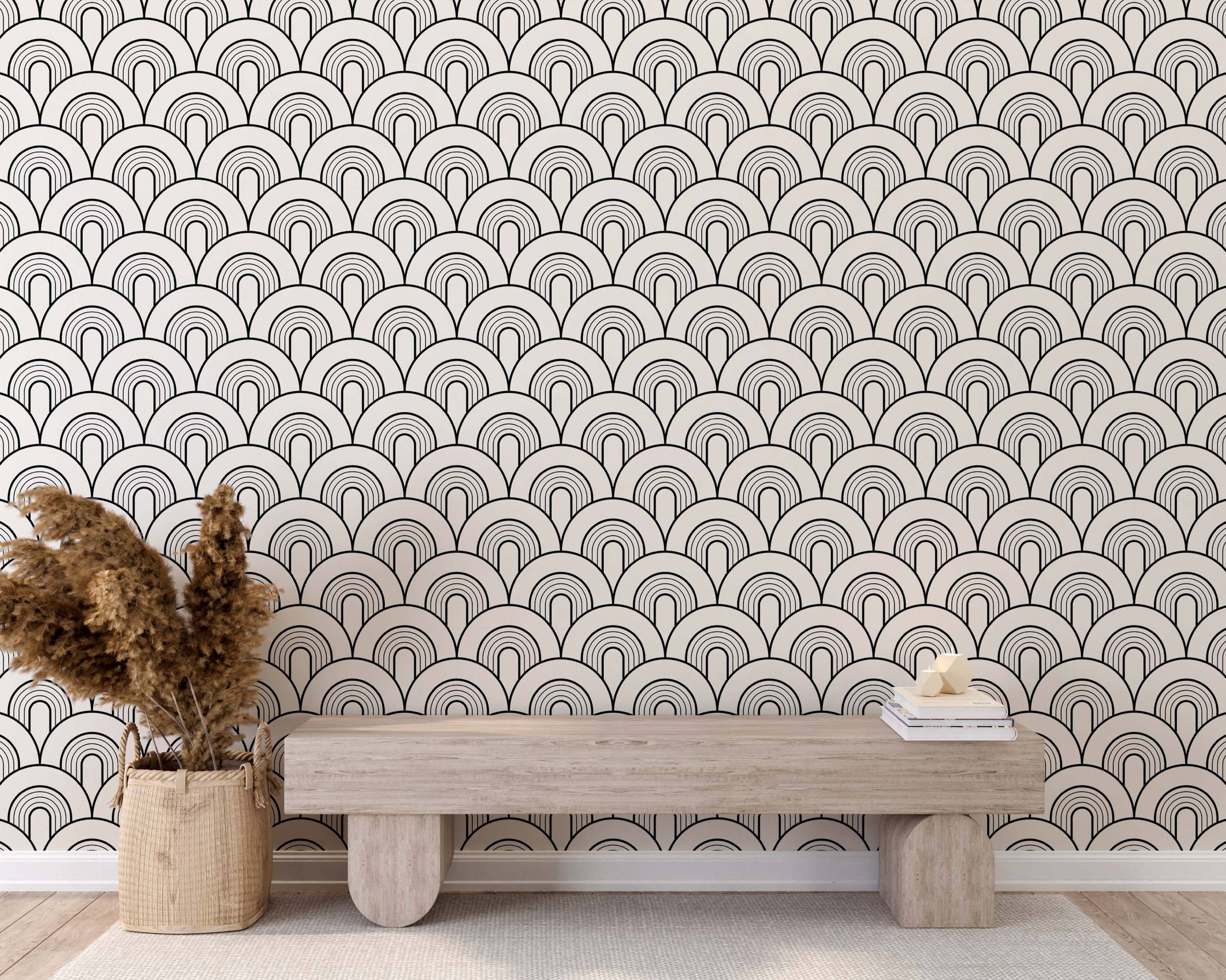 Geometric wallpaper featuring repeating black outlined nested arches on an off-white background, forming a scale pattern.