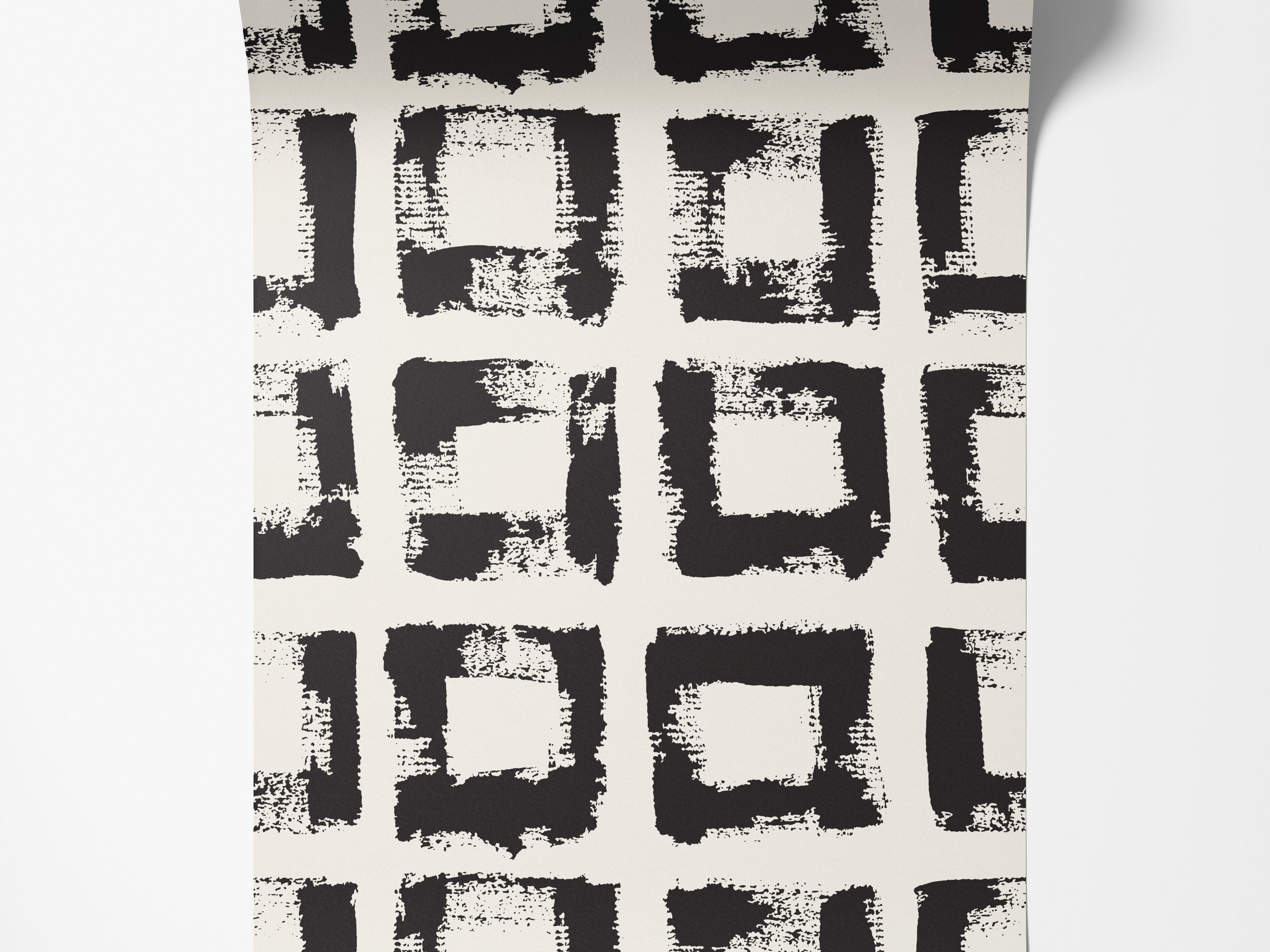 Wallpaper features a grid pattern of hand-painted black squares with rough brushstroke texture on an off-white background.