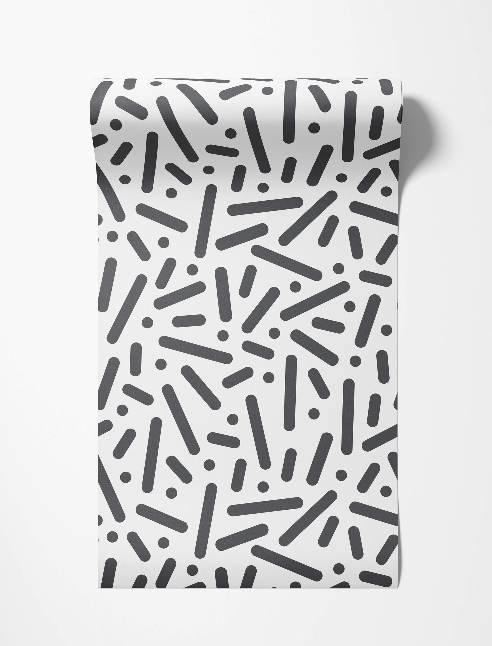Wallpaper featuring a scattered pattern of black rounded rectangles and dots on a white background.