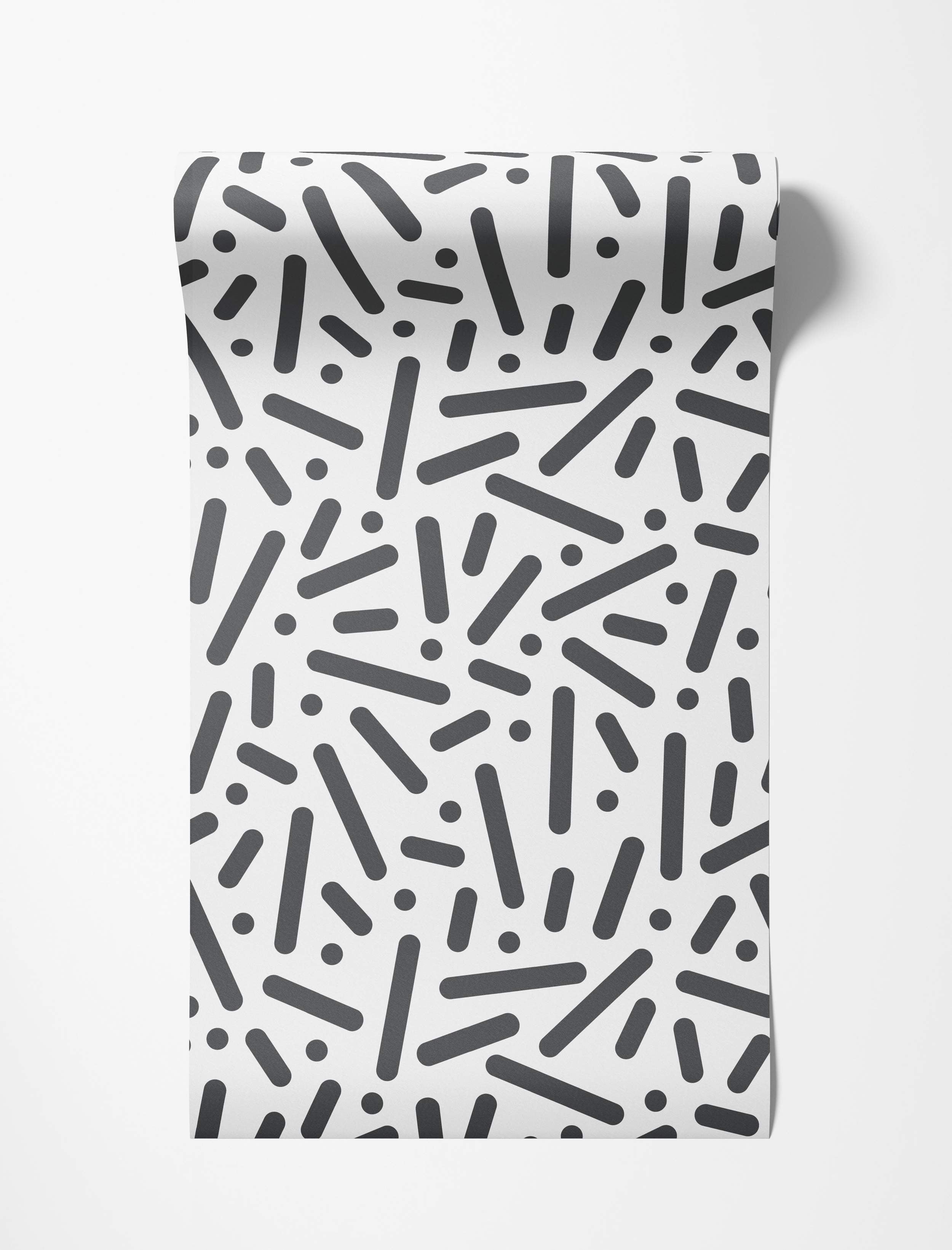 Wallpaper featuring a scattered pattern of black rounded rectangles and dots on a white background.
