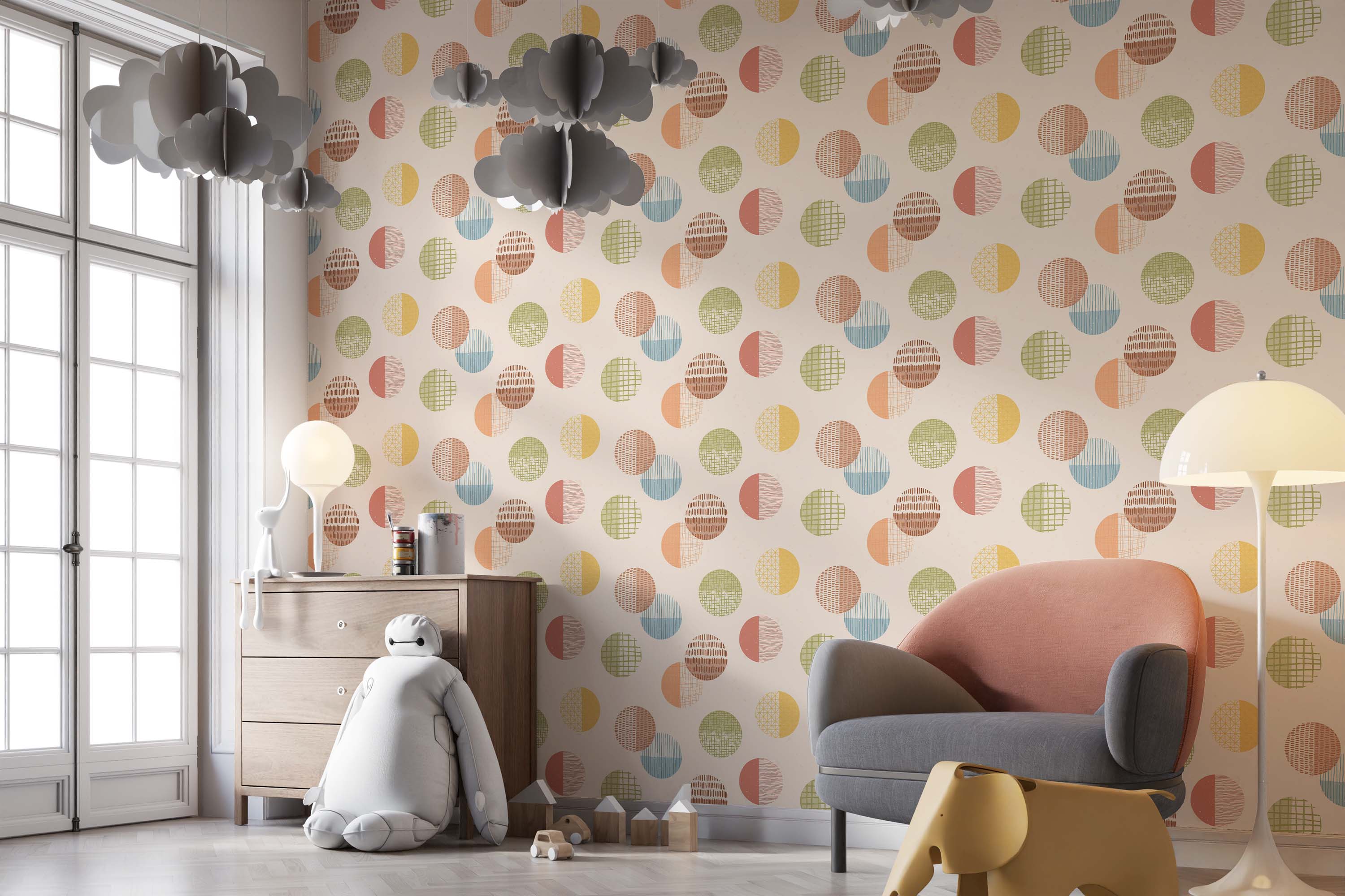 Wallpaper with a geometric pattern of textured circles, often split, in muted orange, yellow, green, and blue hues.