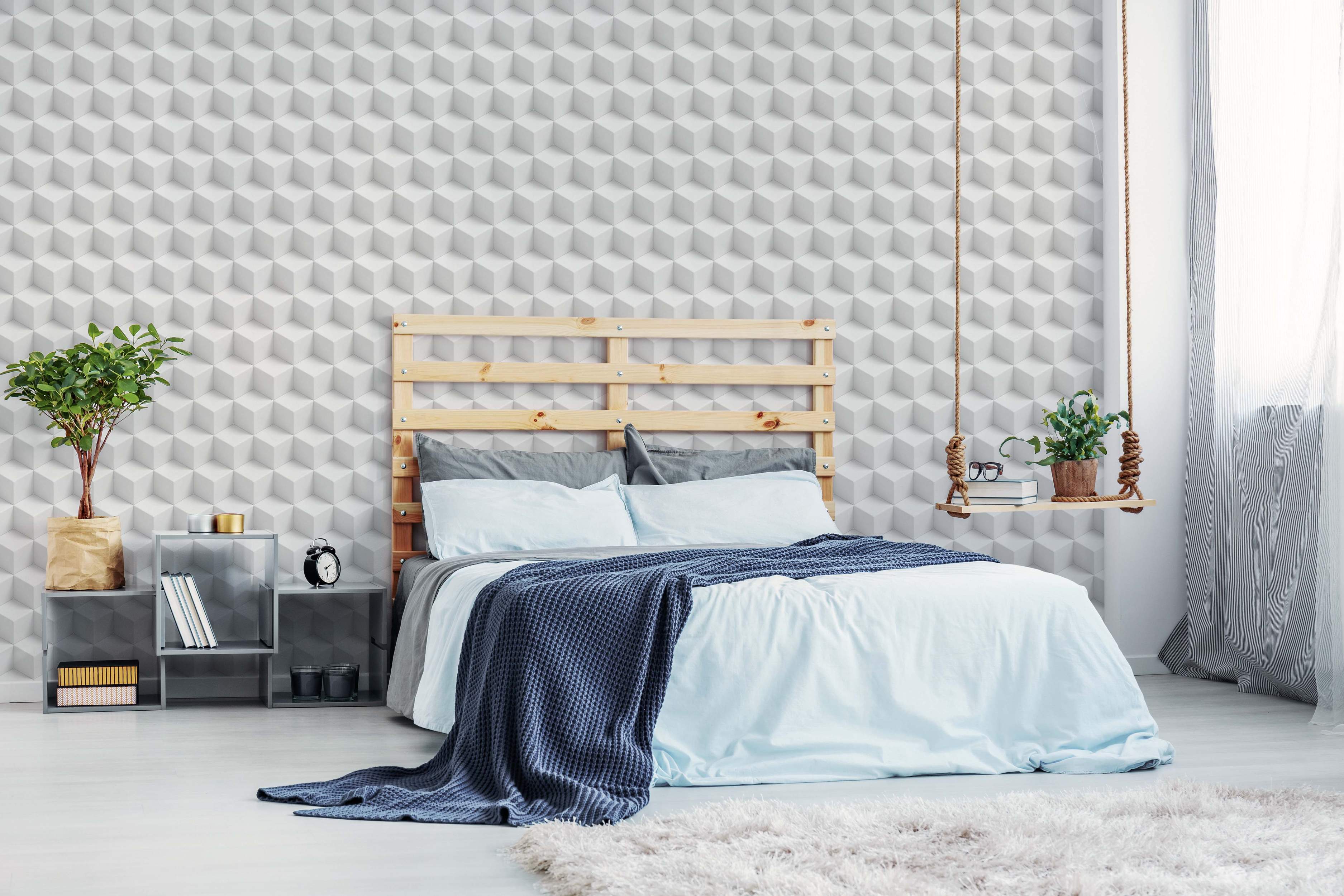 Geometric wallpaper featuring a repeating pattern of white and gray 3D isometric cubes creating an optical illusion.