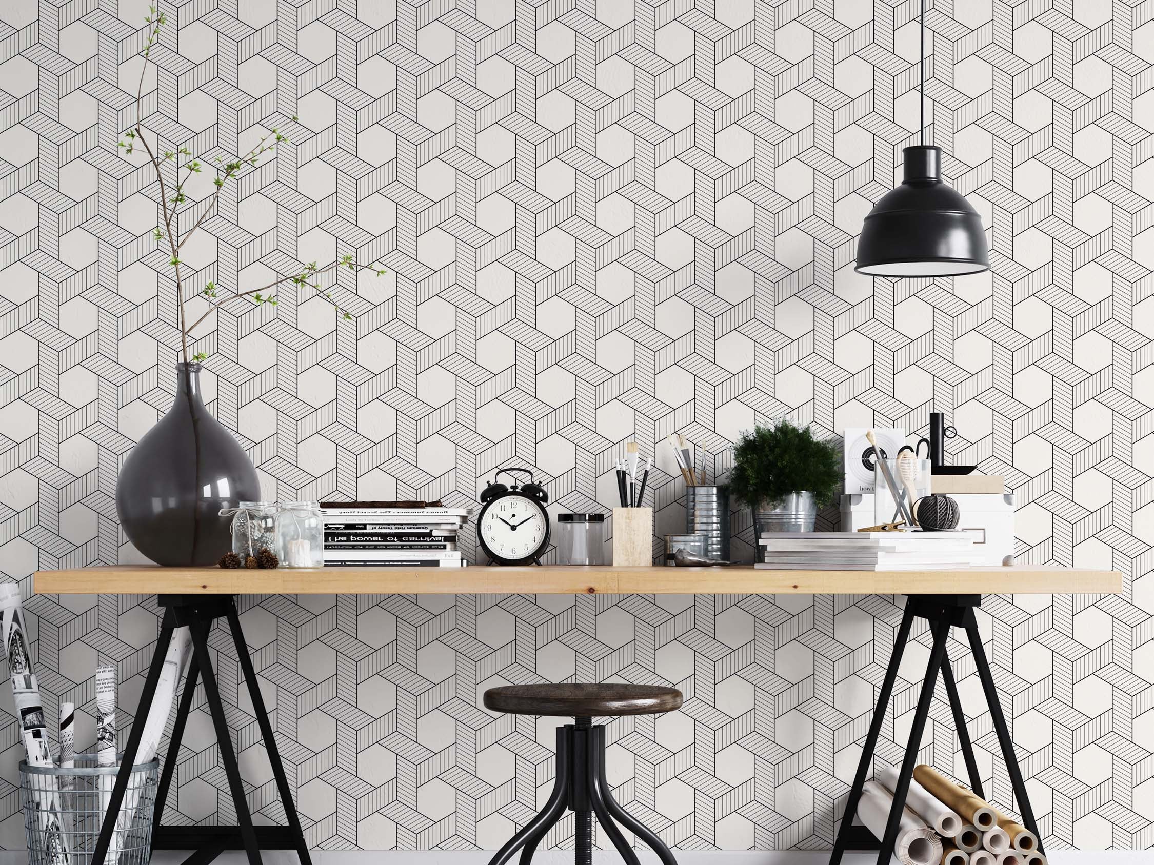 Wallpaper with a repeating geometric pattern of interlocking black line cubes on white, creating a 3D optical illusion.