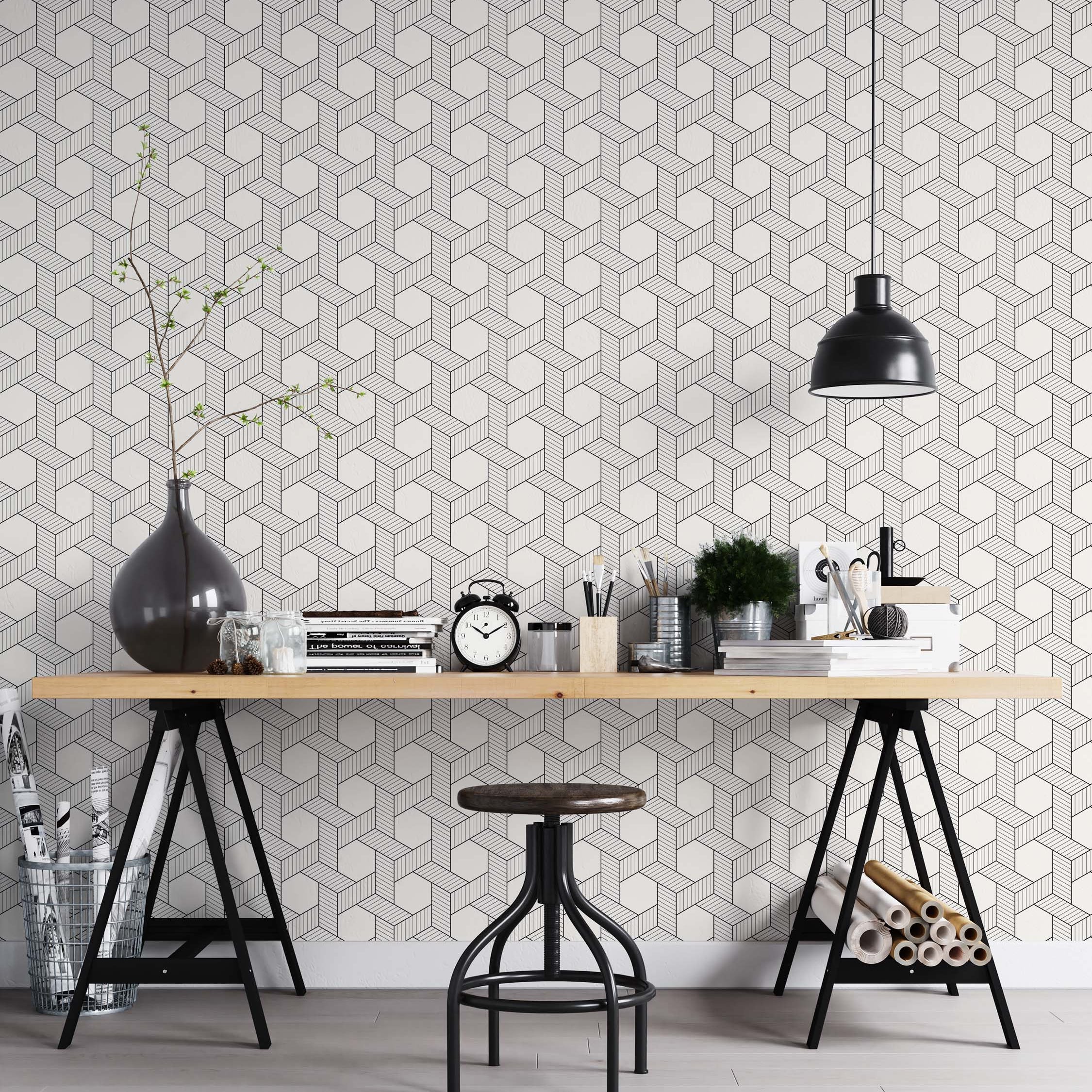 Wallpaper with a repeating geometric pattern of interlocking black line cubes on white, creating a 3D optical illusion.