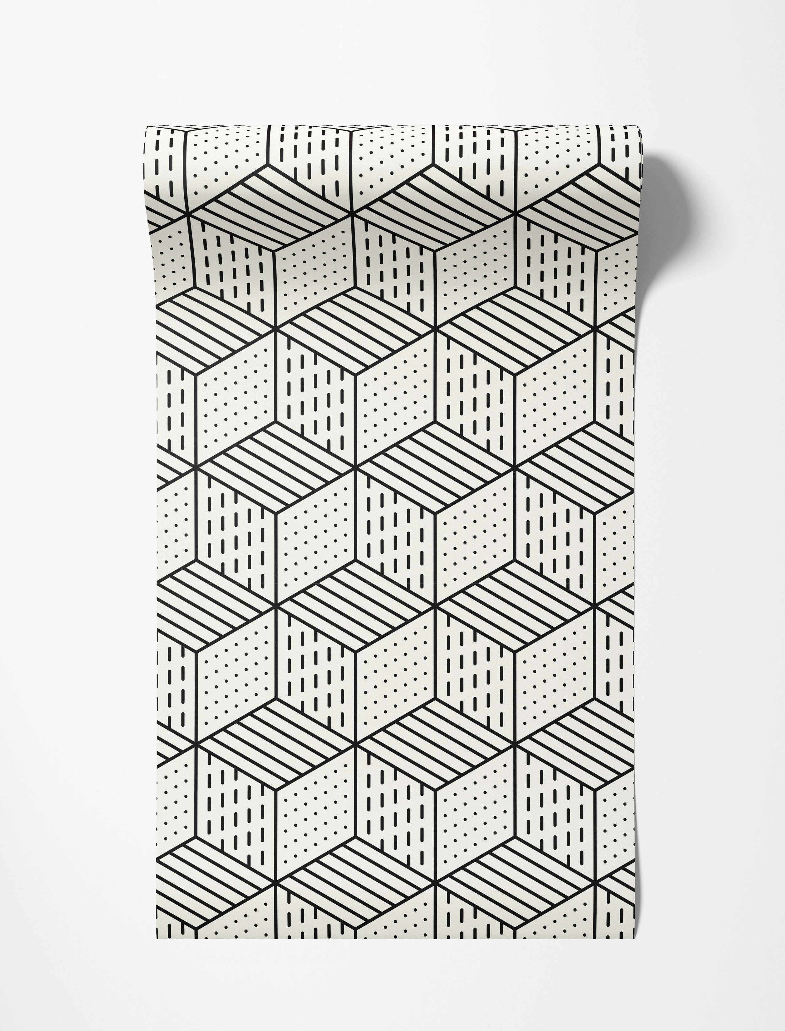 Geometric wallpaper with black isometric cubes on off-white. Faces feature dots, horizontal lines, and vertical dashes.