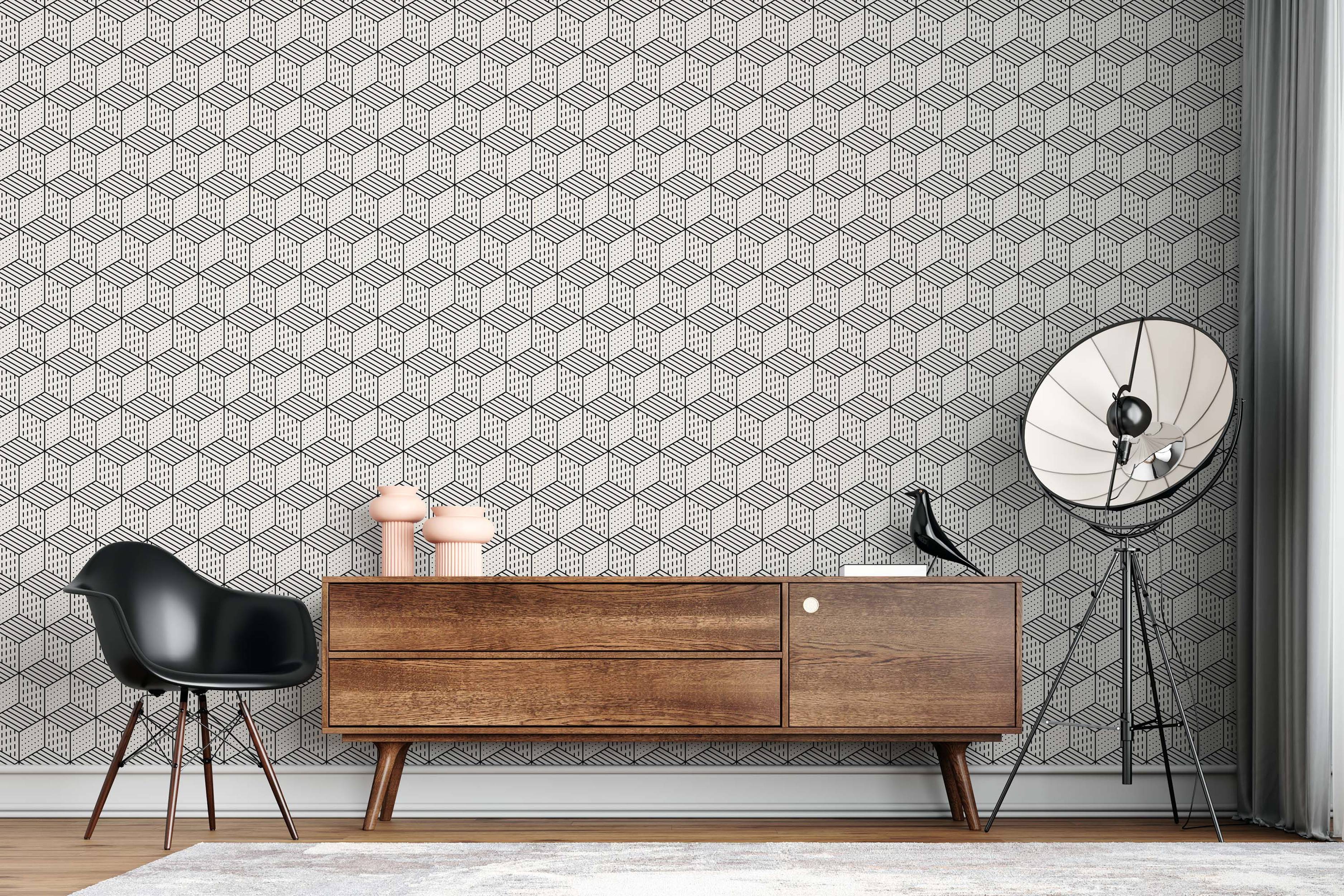 Geometric wallpaper featuring isometric cubes with black line patterns (lines, dashes, dots) on a light beige background.