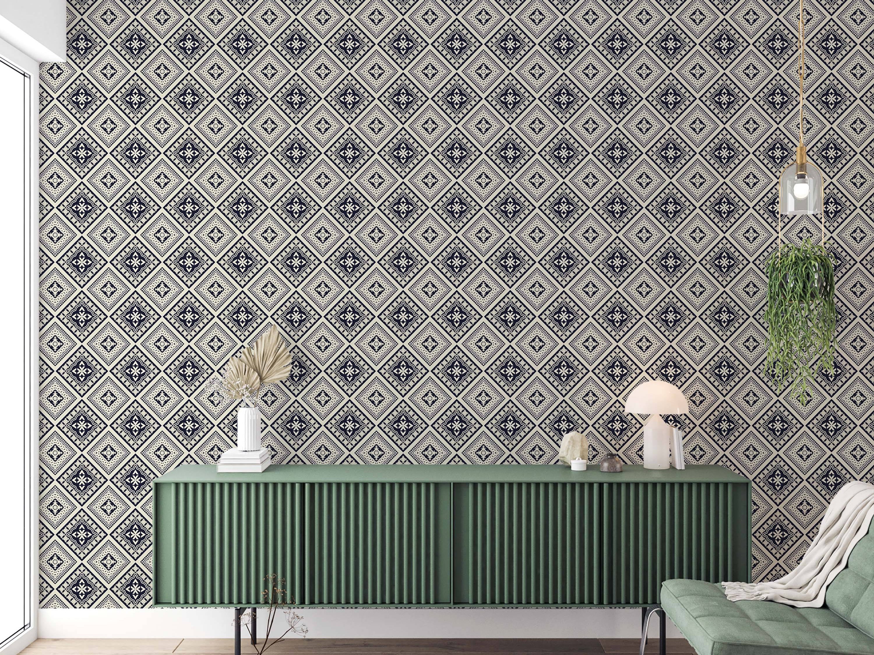 Geometric wallpaper featuring intricate diamond tiles with cross motifs in dark blue, cream, and gray.