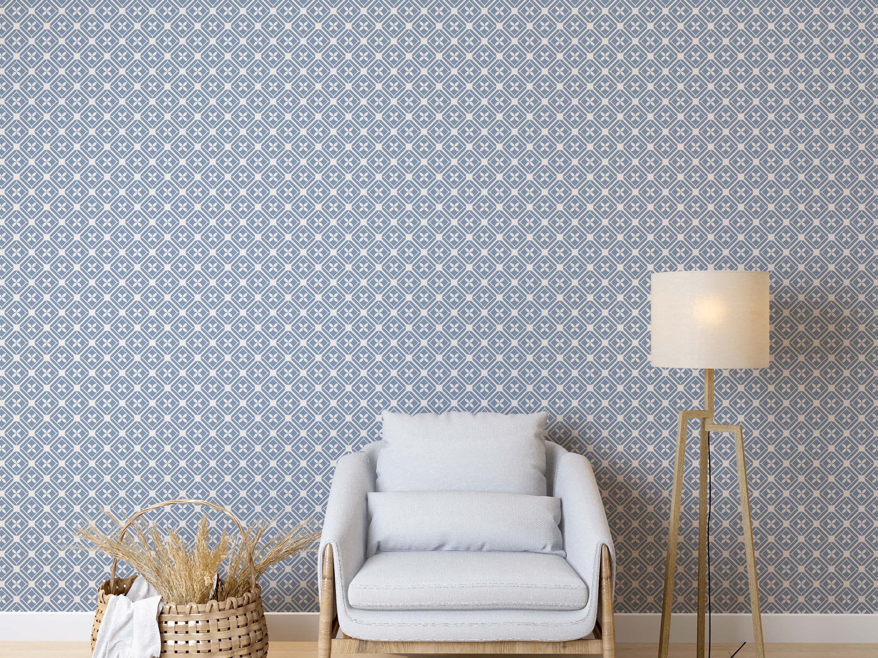 Geometric wallpaper with a repeating blue diamond pattern on a cream background, each diamond featuring a cream four-petal motif.